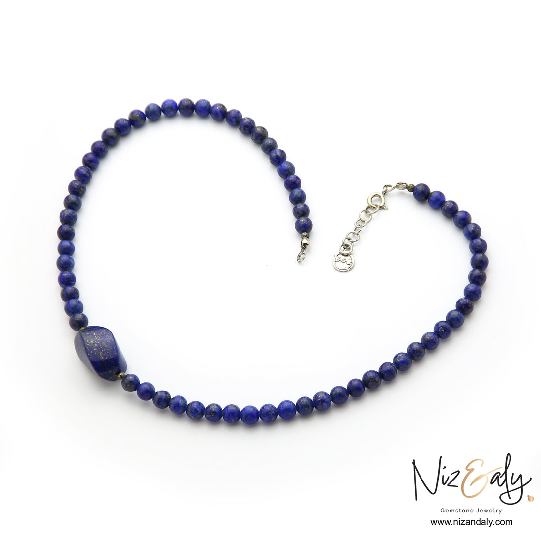 Niz & Aly Lapis Lazuli beaded necklace with a central raw gemstone pendant featuring deep blue and gold flecks.