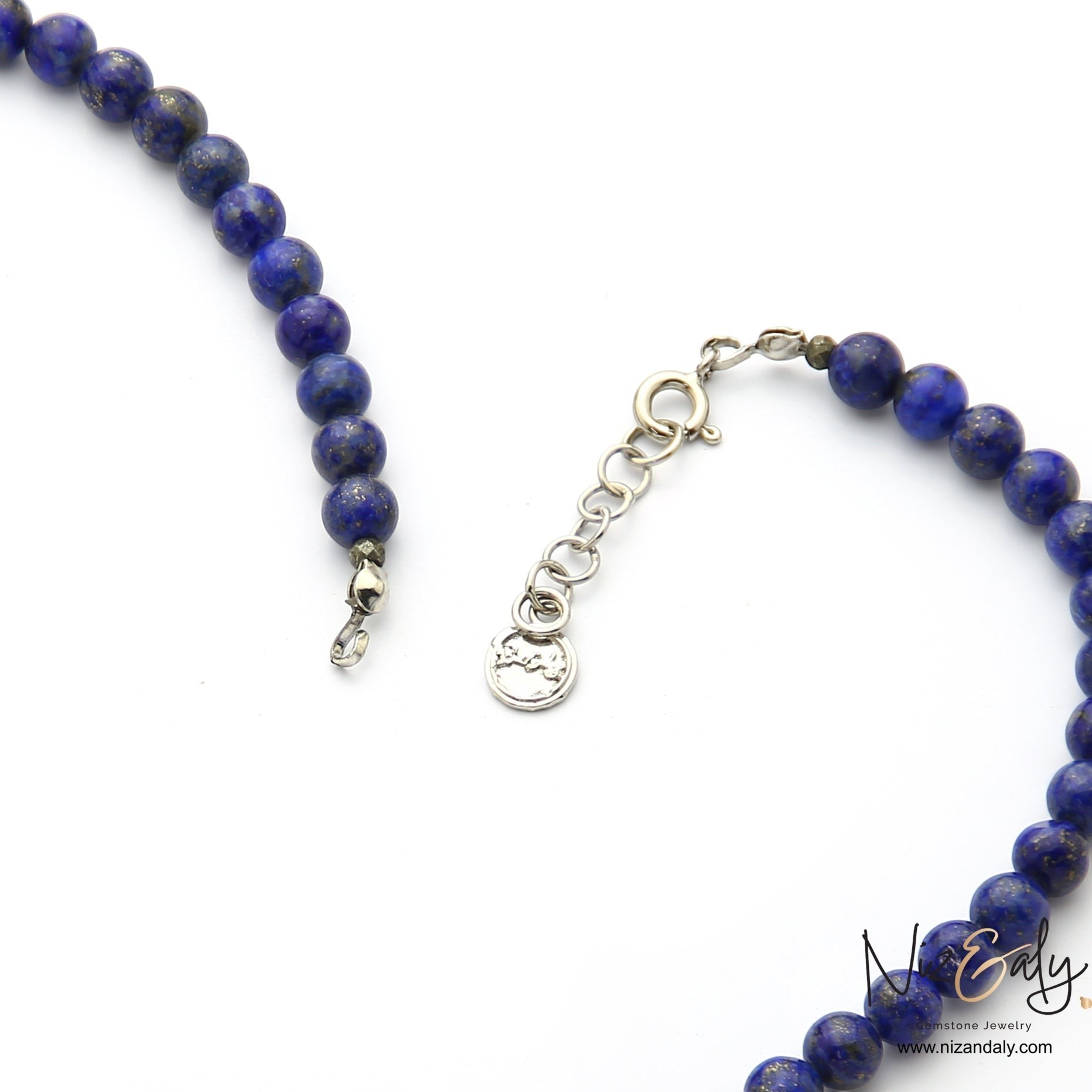 Niz & Aly Lapis Lazuli beaded necklace with silver clasp and extender chain featuring natural deep blue gemstone beads.