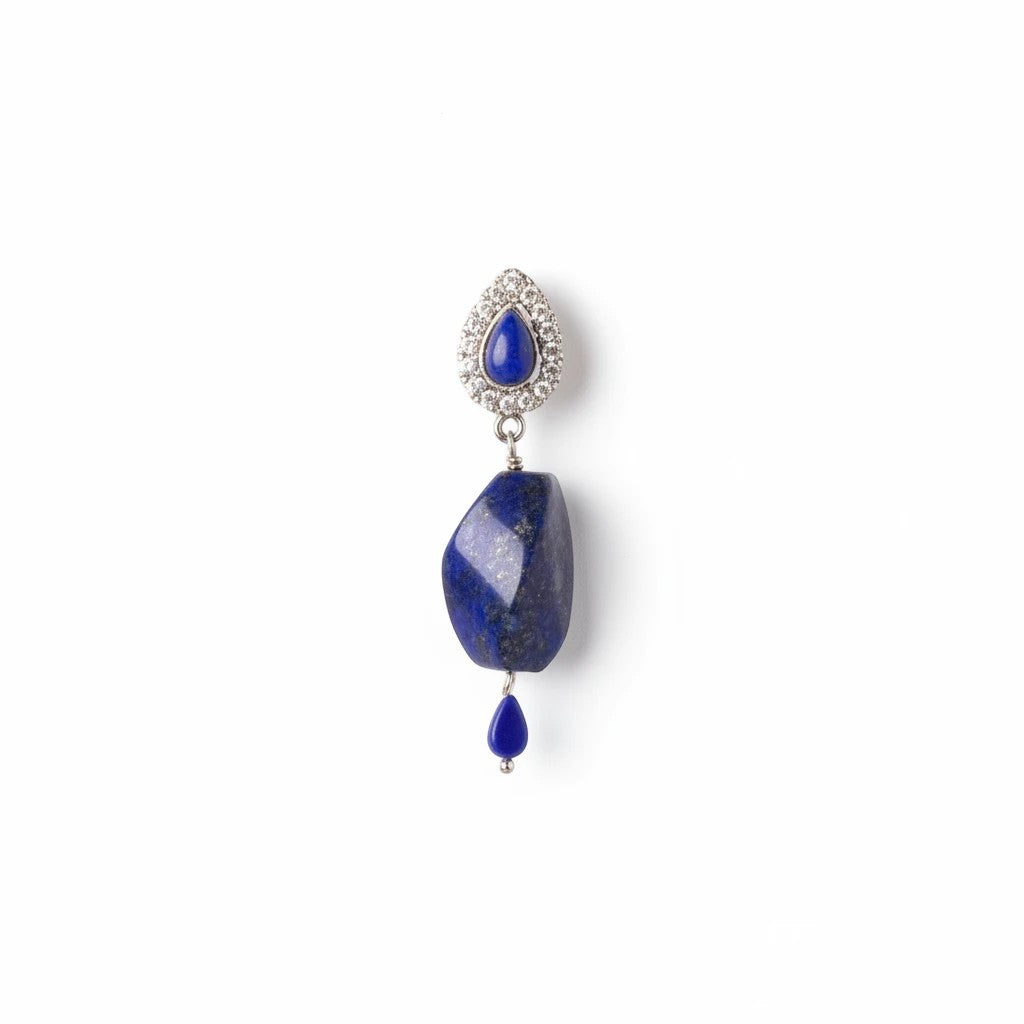 Niz & Aly lapis lazuli drop earring featuring a polished blue stone, a crystal-encrusted teardrop, and silver setting.