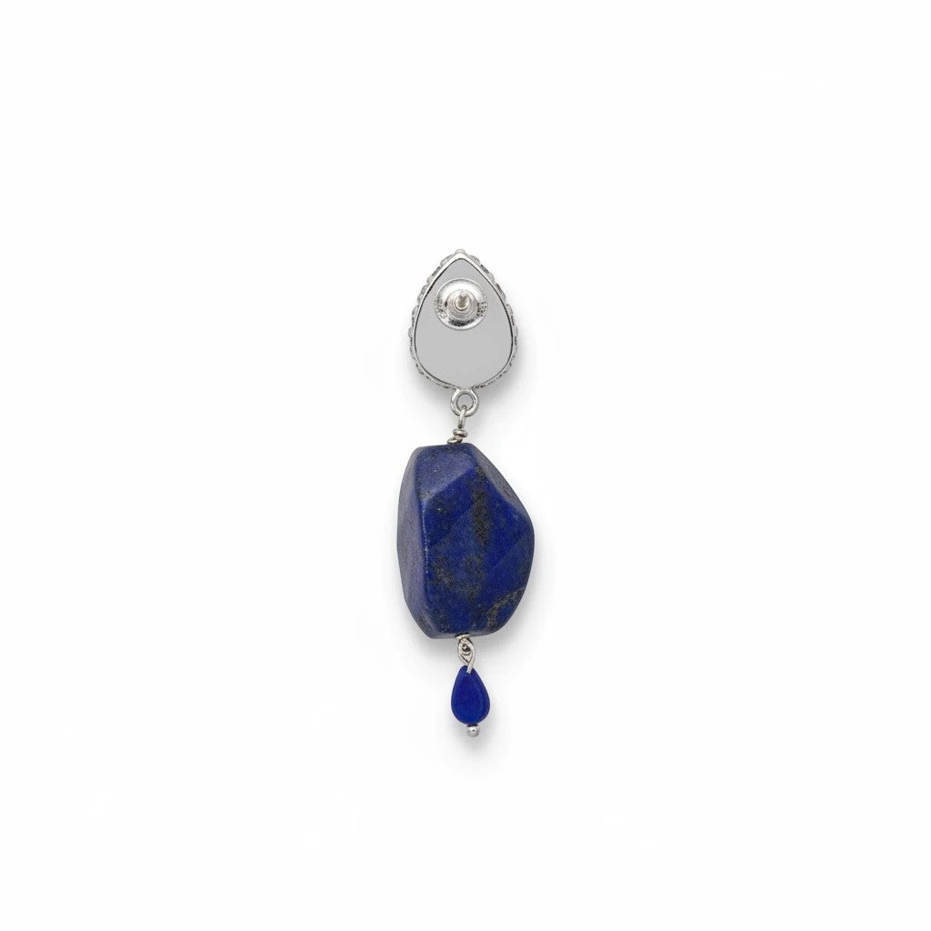 Niz & Aly lapis lazuli drop earring featuring a polished royal blue gemstone and a small teardrop accent in silver.