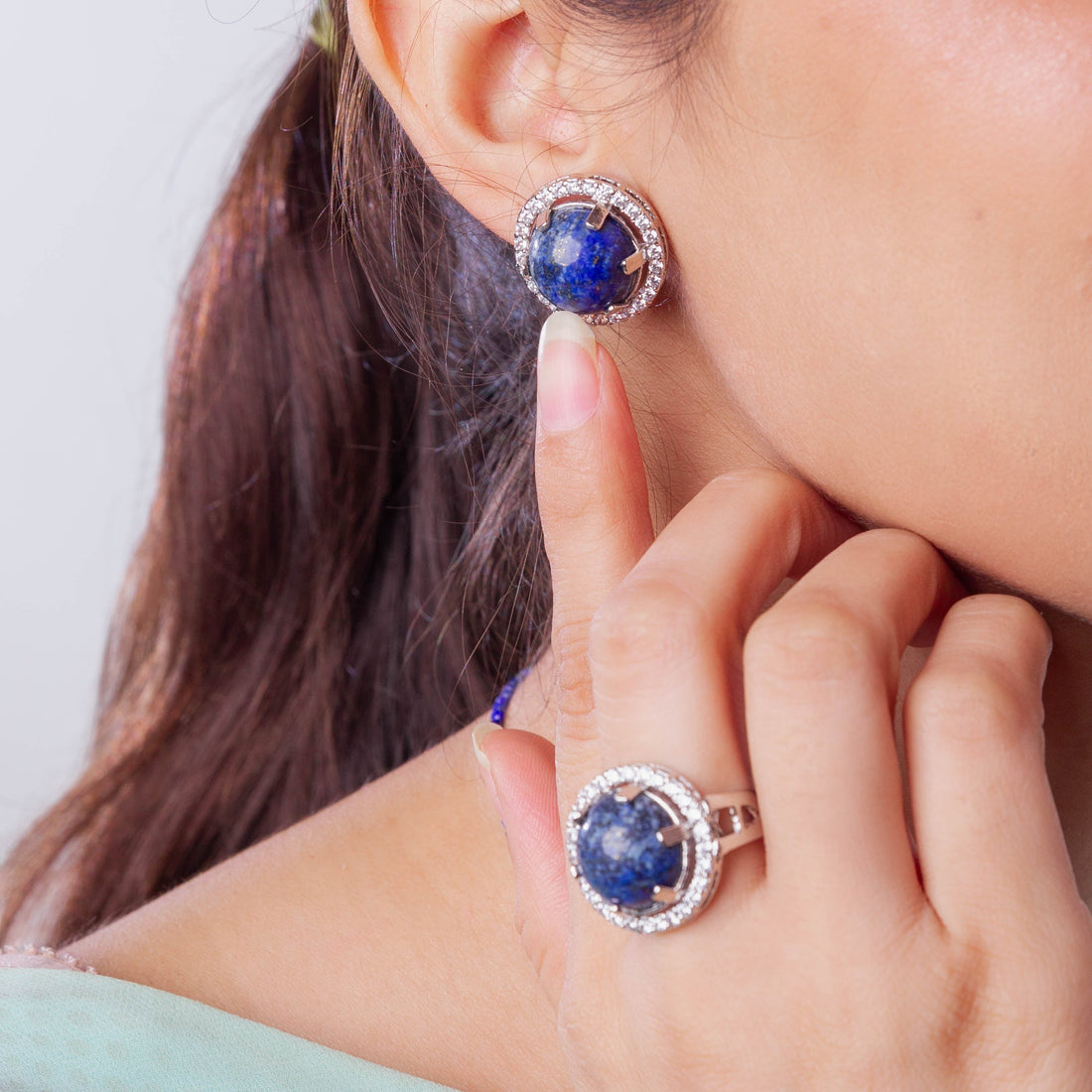 Niz & Aly Celestial Blue Lapis Set featuring a round lapis lazuli earring and ring with diamond-encrusted halos.
