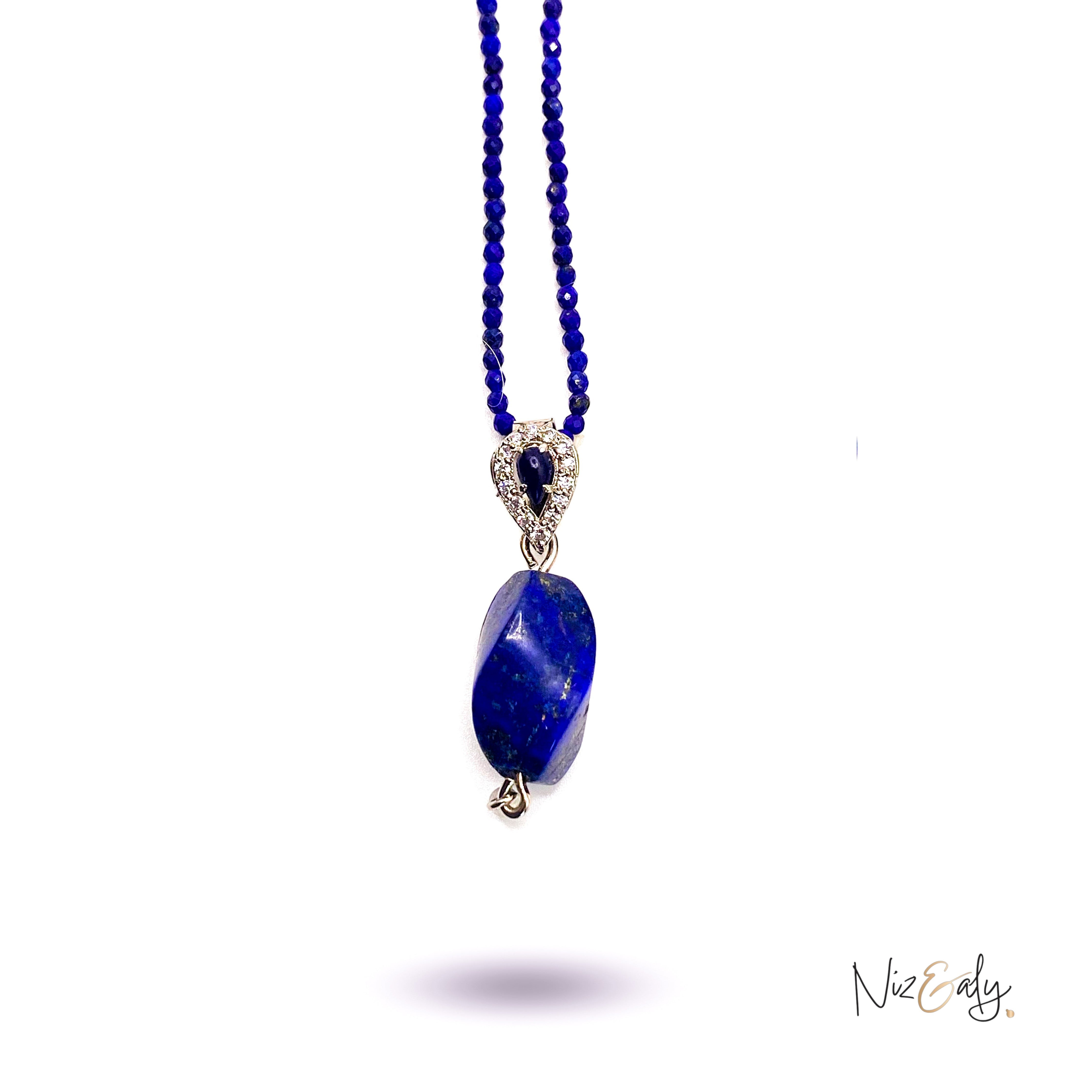 Niz & Aly tear drop lapis lazuli pendant on a delicate beaded lapis necklace with silver accents