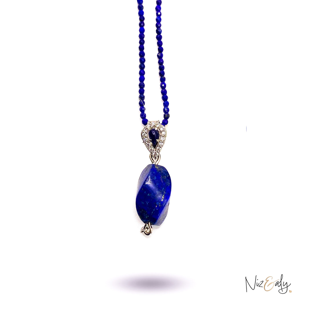 Niz & Aly tear drop lapis lazuli pendant on a delicate beaded lapis necklace with silver accents