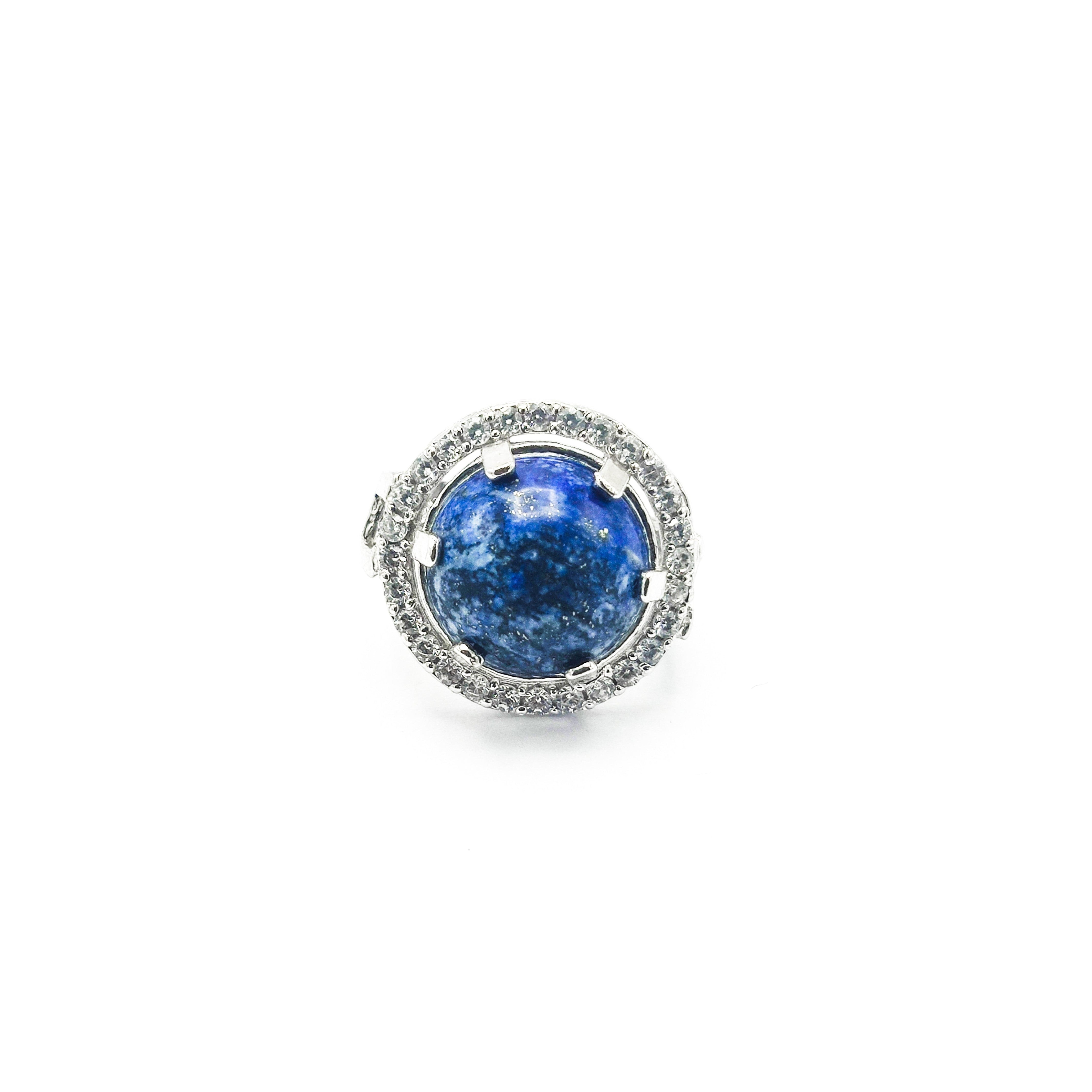 Niz & Aly Celestial Blue Lapis ring featuring a round lapis lazuli gemstone with gold flecks in a silver halo setting.