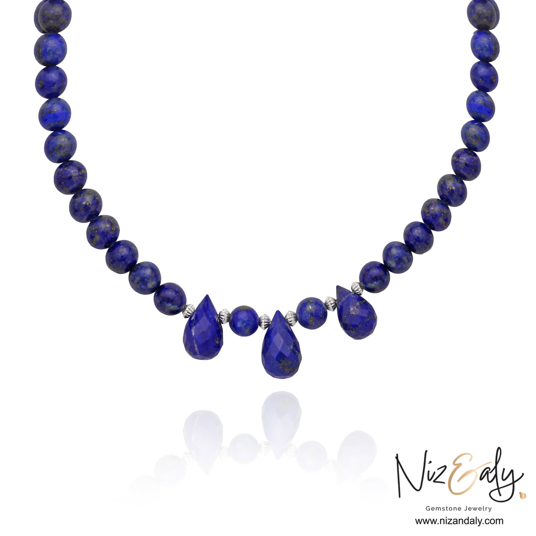 Niz & Aly handcrafted lapis lazuli necklace featuring deep blue round beads and three teardrop gemstone pendants.