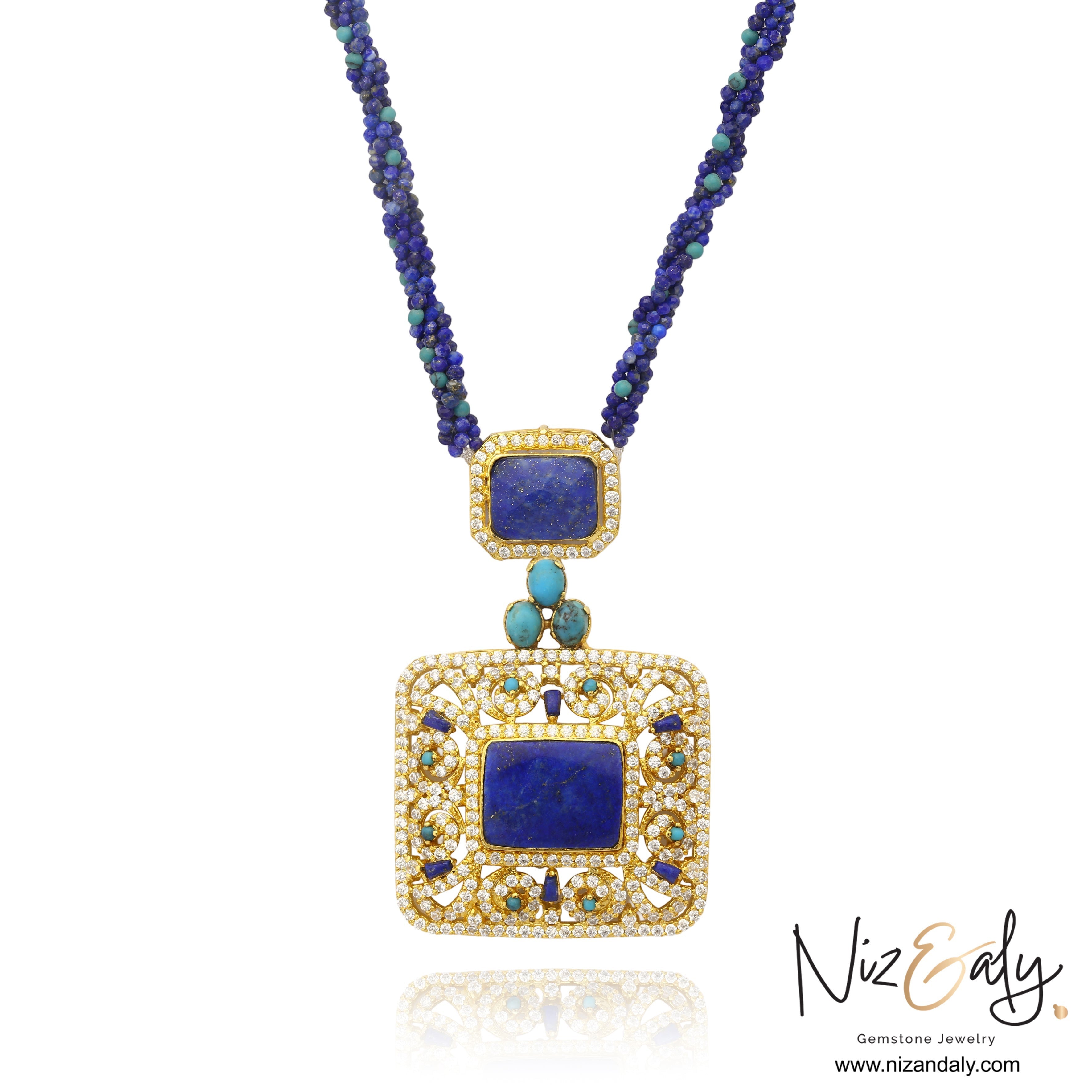 Niz & Aly Blue Monarch statement necklace featuring a square lapis lazuli pendant, Kingman turquoise, and gold detailing.