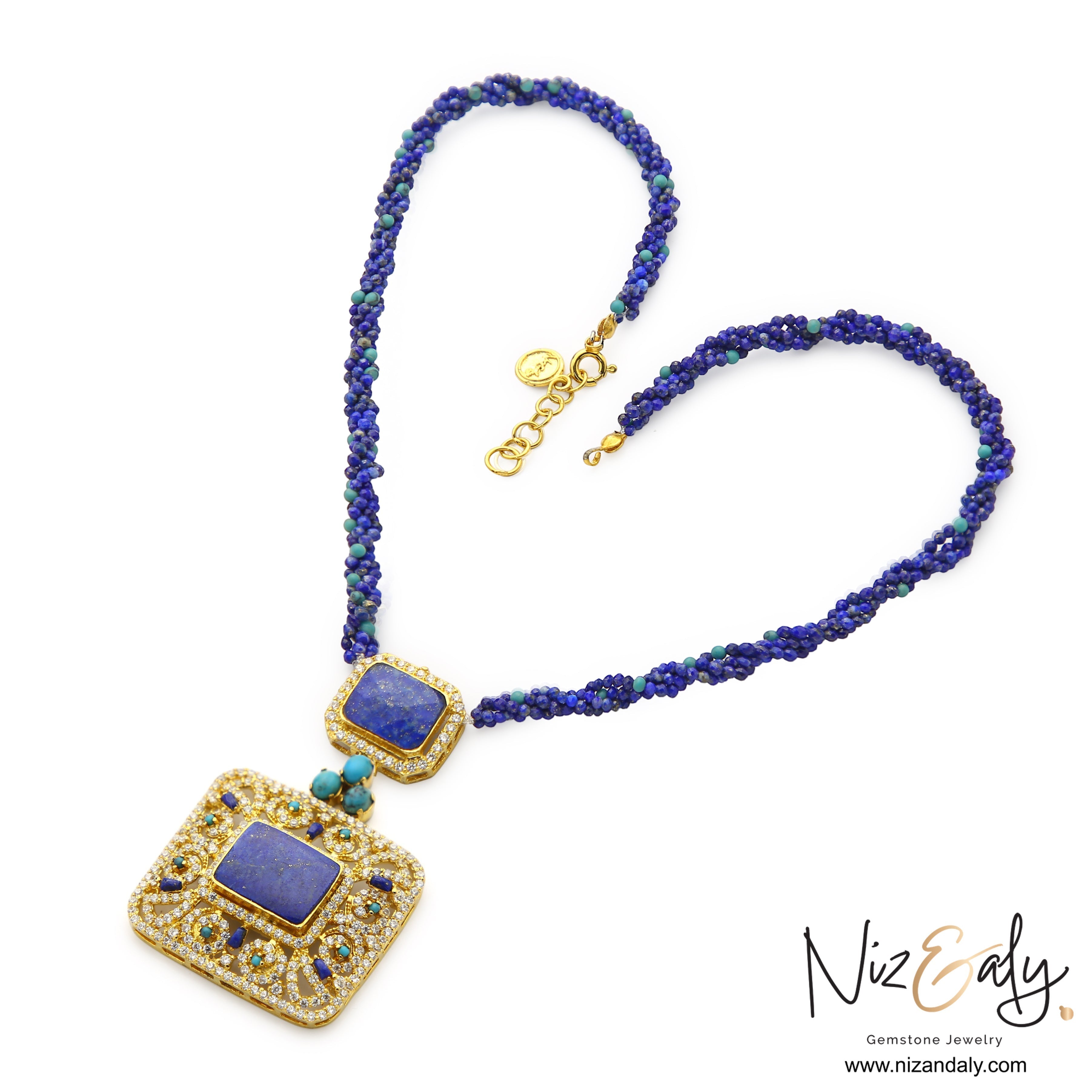 Niz & Aly handcrafted statement necklace featuring a square lapis lazuli pendant, turquoise accents, and beaded strands.