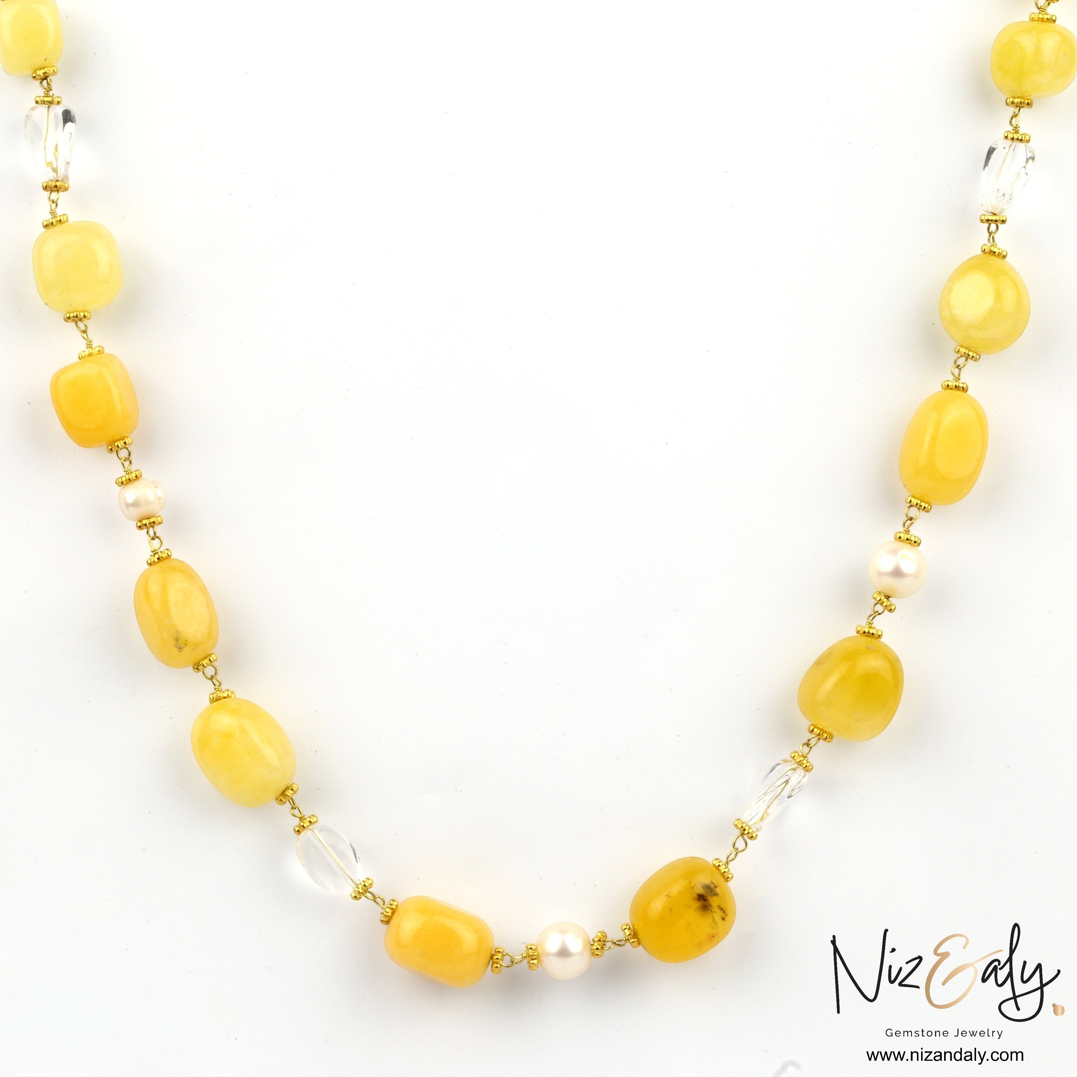Niz & Aly lemon chiffon jade, icy quartz, and freshwater pearl beaded necklace with gold accents.