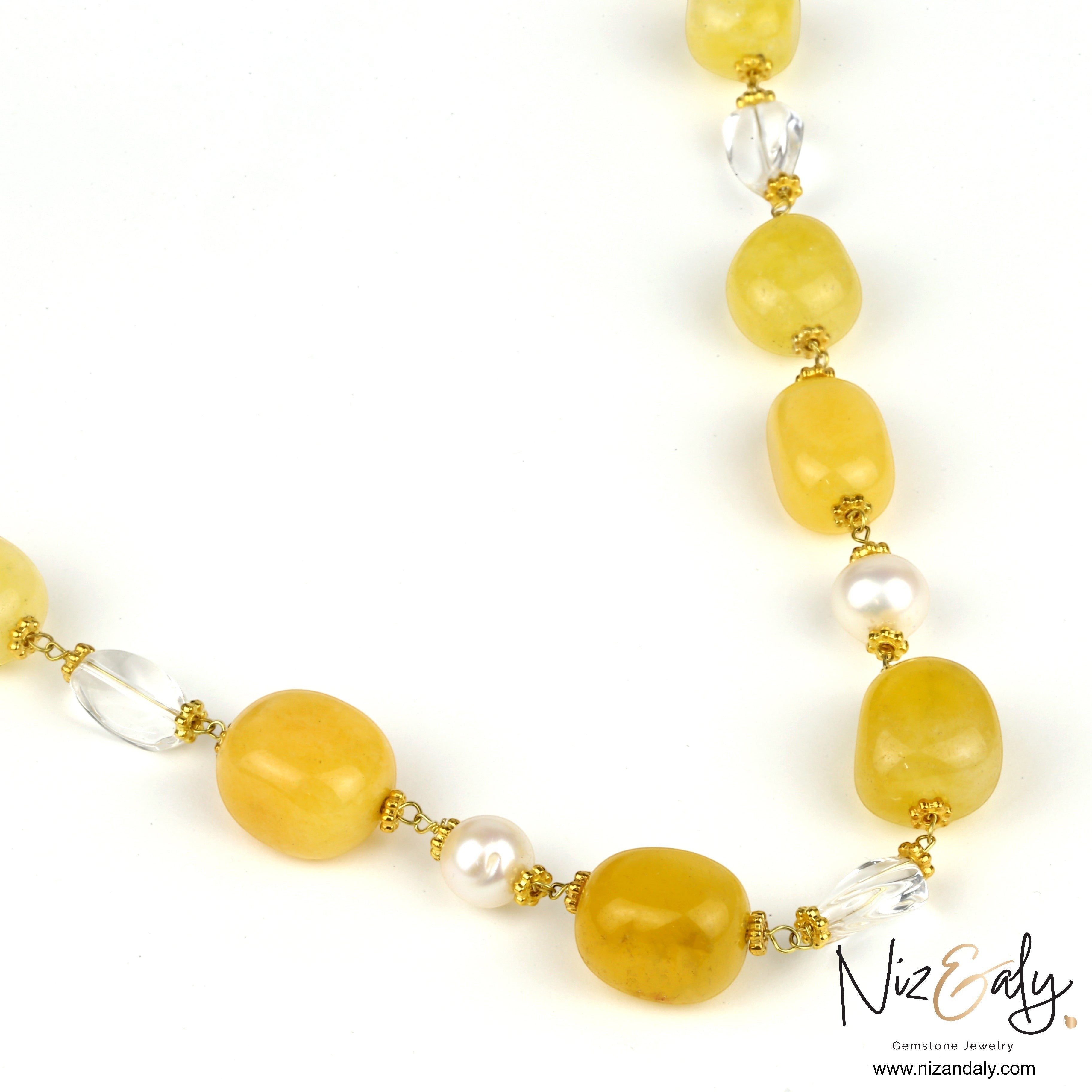 Niz & Aly lemon chiffon jade, icy quartz, and freshwater pearl beaded necklace with gold accents.