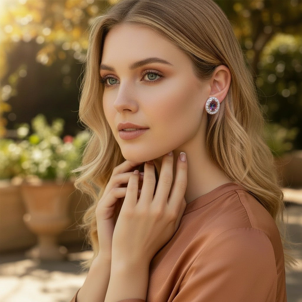 Niz & Aly lilac kunzite halo stud earrings worn by a blonde woman in a sunlit outdoor garden setting.