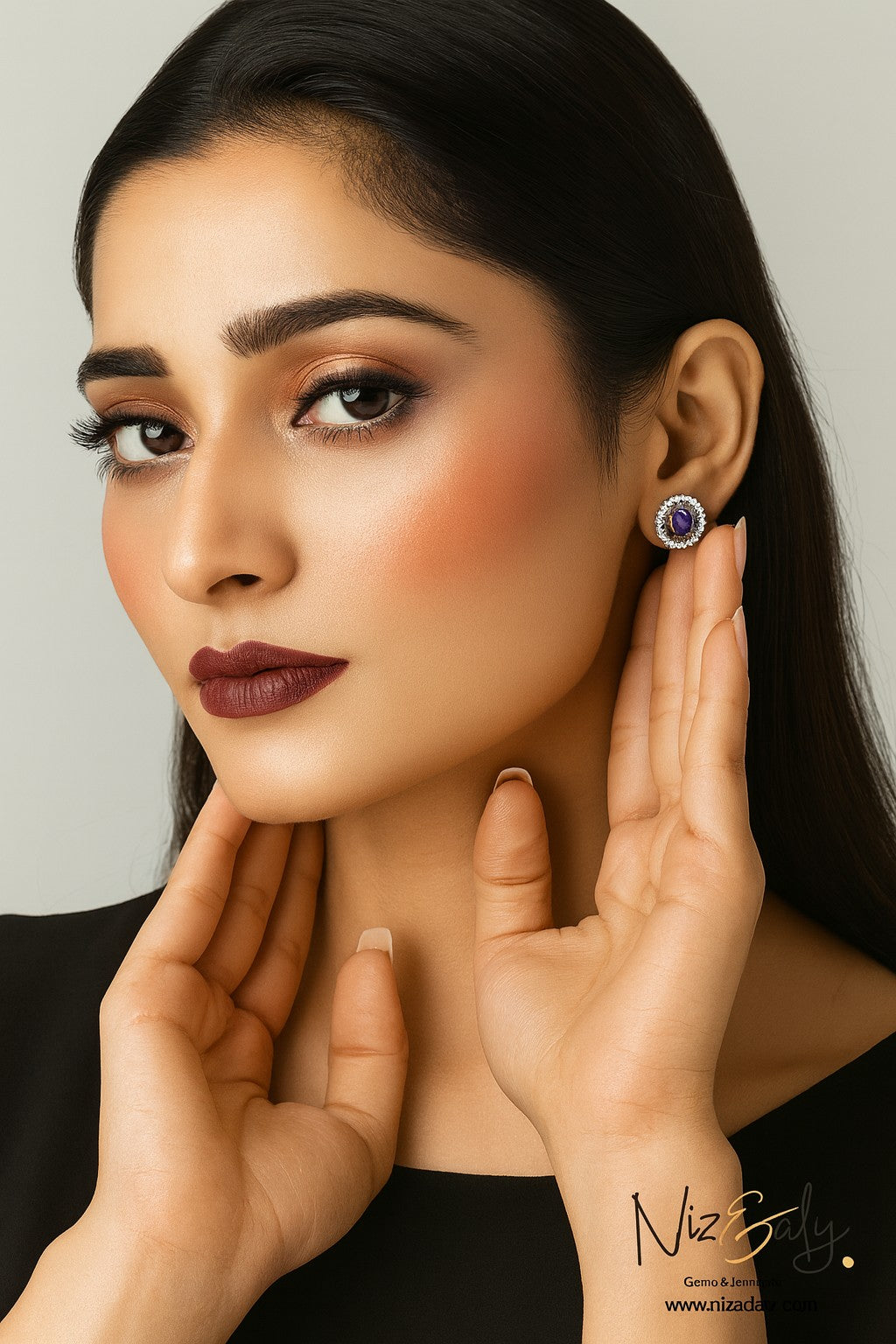 Niz & Aly oval lilac kunzite halo stud earrings worn by a woman with elegant makeup and dark hair.