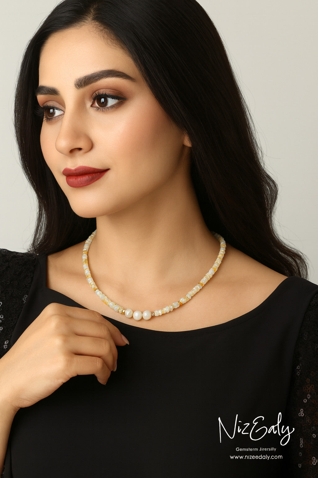 Niz & Aly Lunar Grace necklace featuring Ethiopian opal beads and three central freshwater pearls on a model