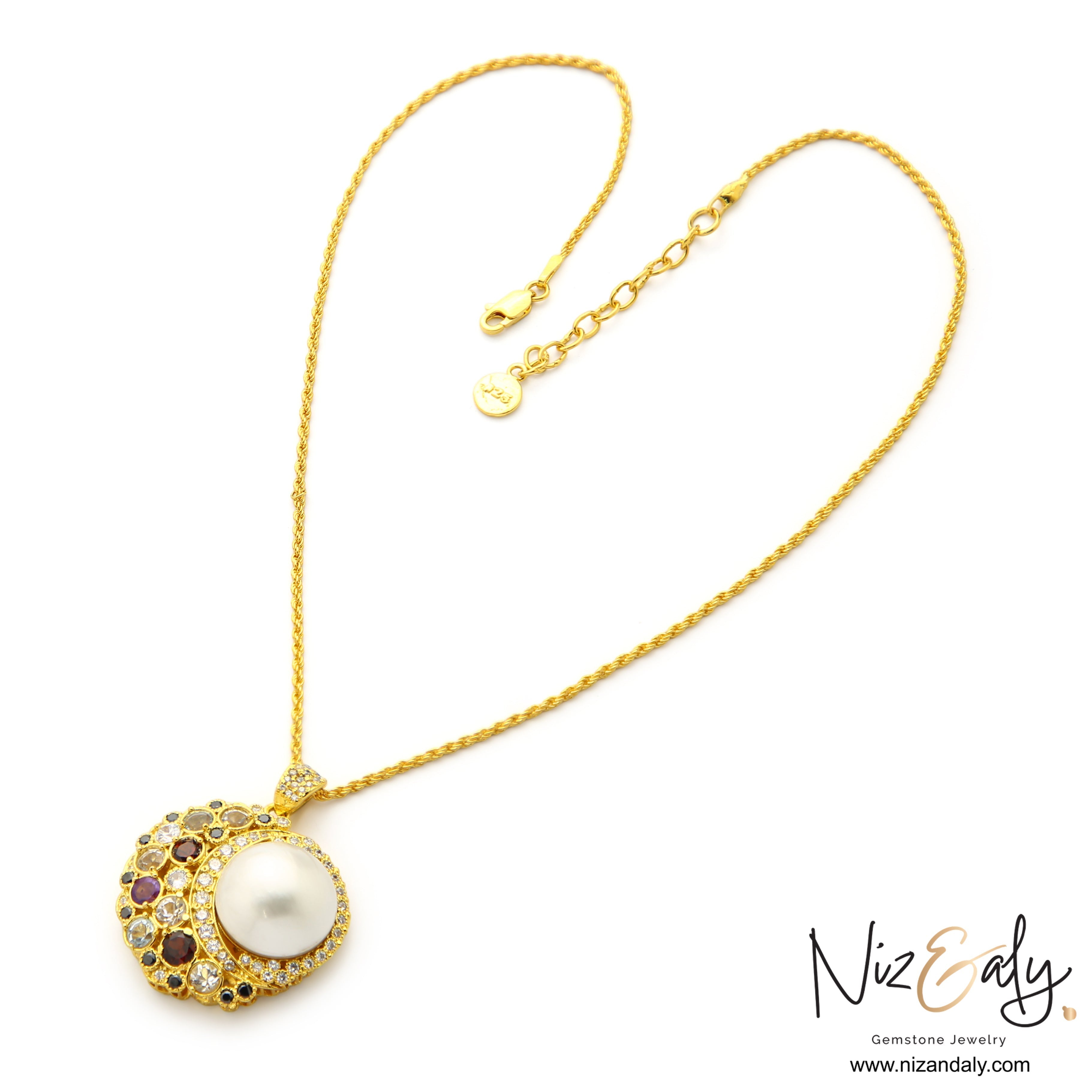 Niz & Aly handcrafted mabe pearl pendant necklace with amethyst, garnet, and sapphire on a gold twisted rope chain.