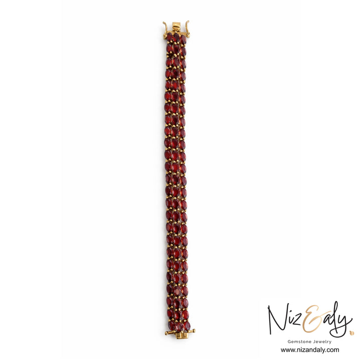 Niz & Aly multi-row bracelet featuring 93 marquise-cut rhodolite garnet stones set in 14K gold-plated sterling silver.