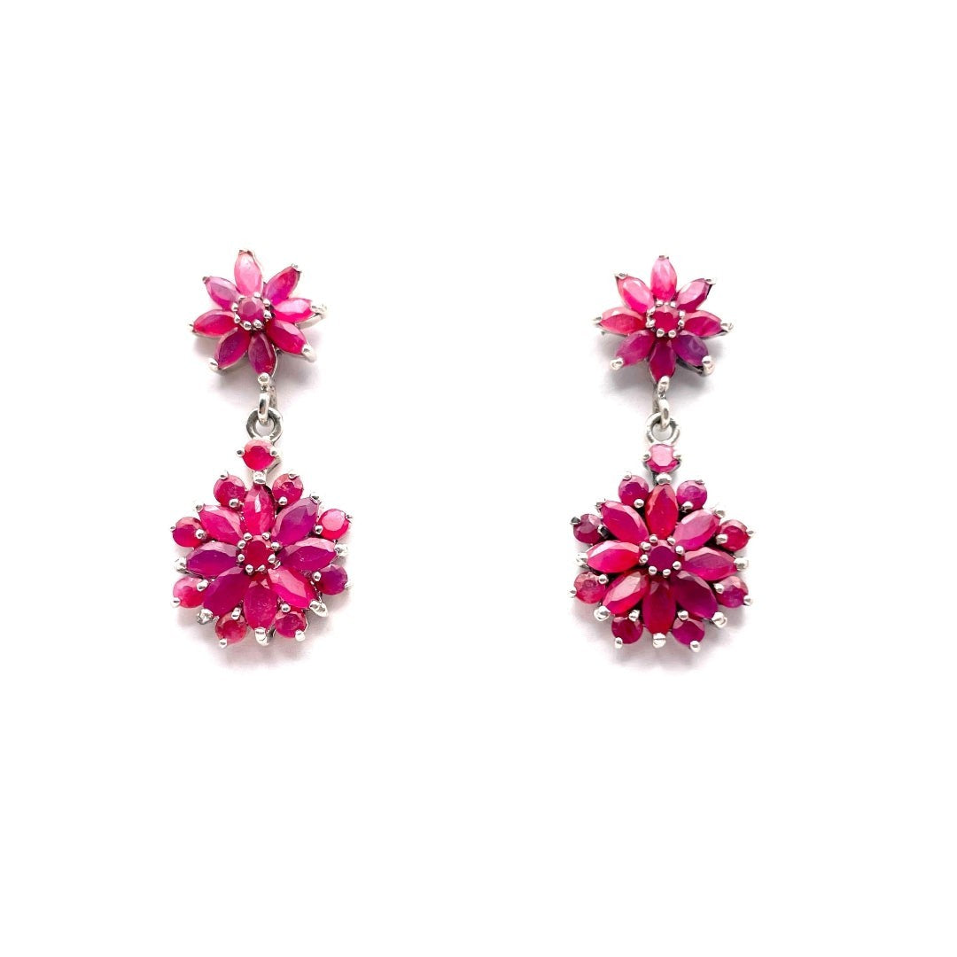 Niz & Aly marquise cut ruby drop earrings featuring floral clusters of deep red gemstones in a silver setting.
