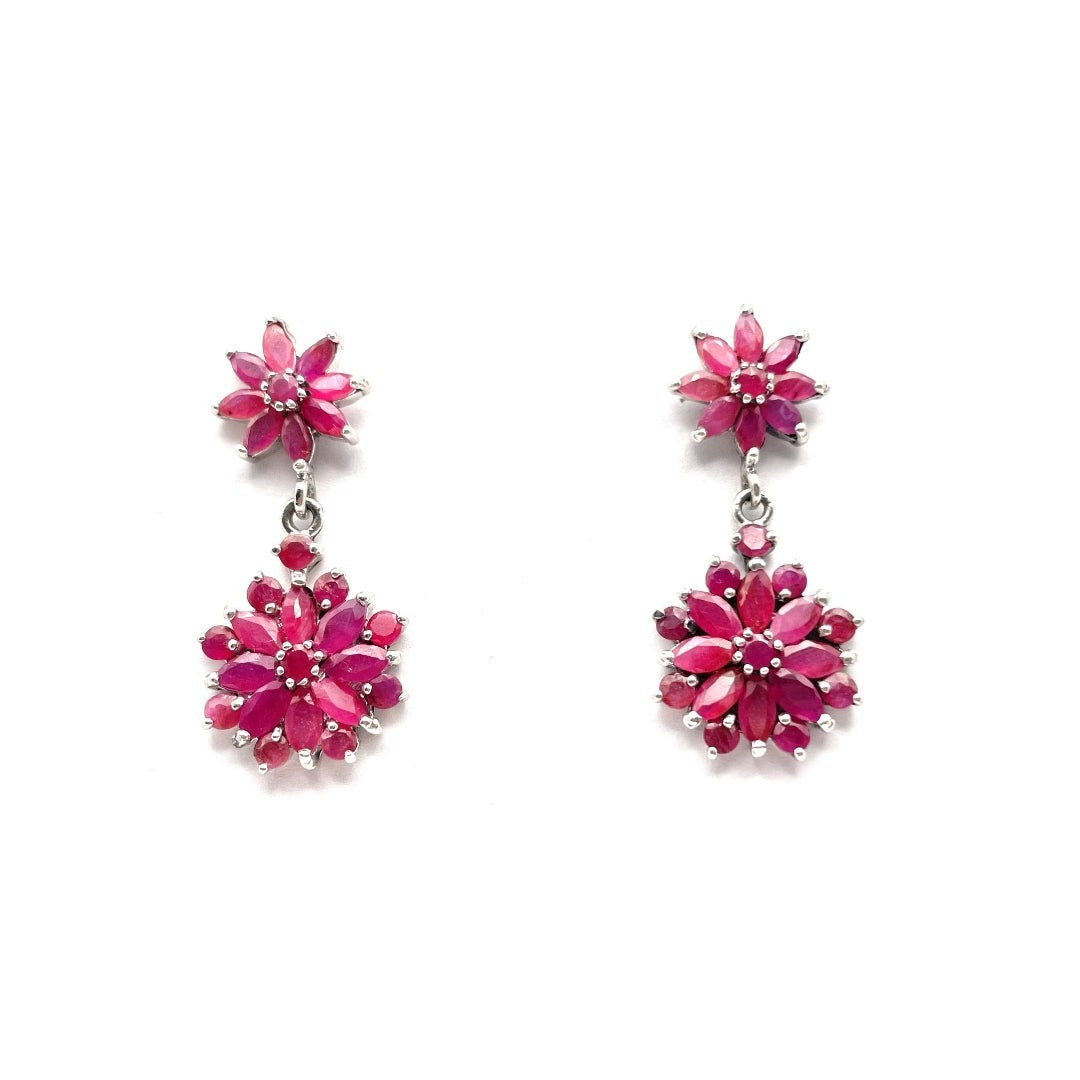 Niz & Aly marquise cut ruby drop earrings featuring floral clusters of deep red gemstones in a silver setting.