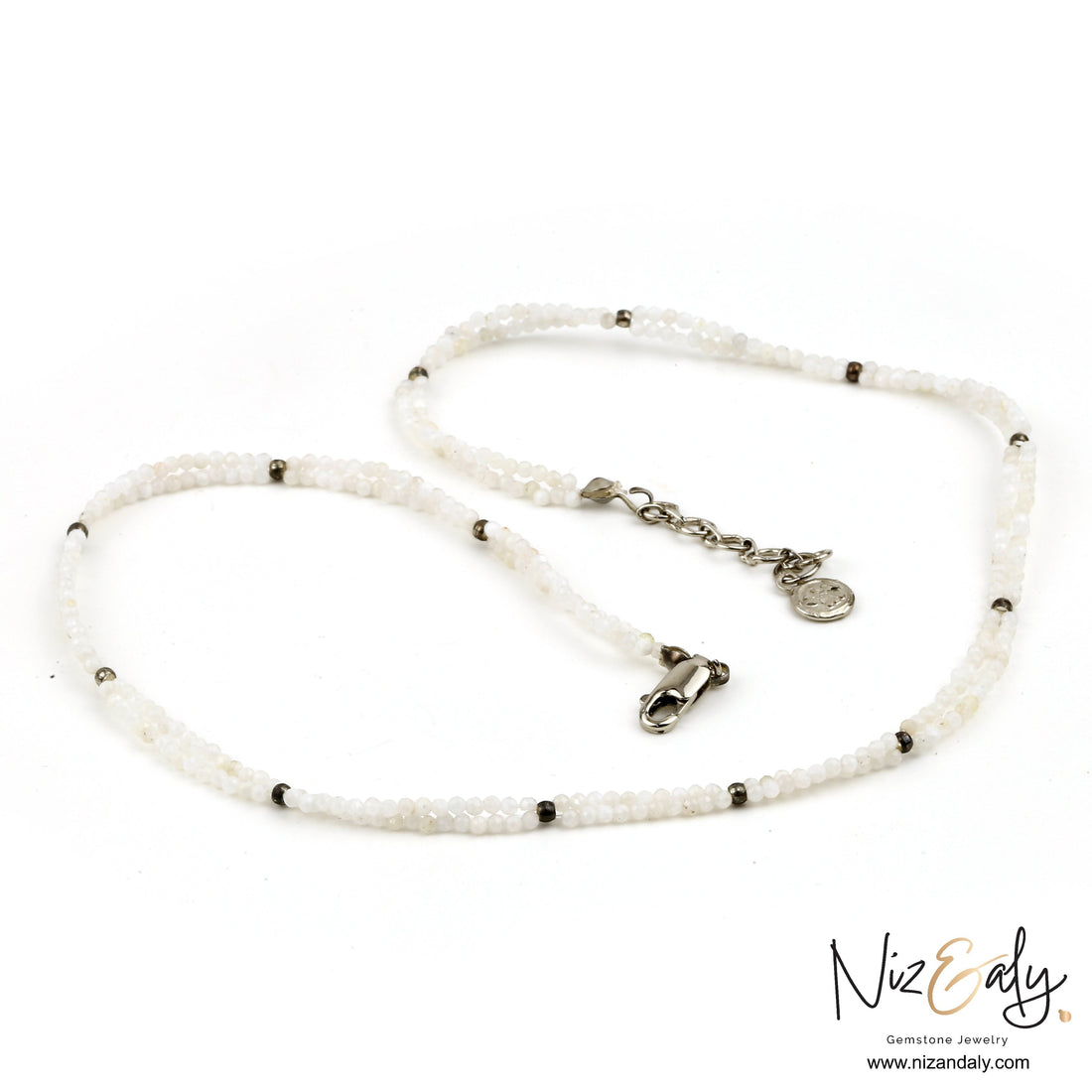 Niz & Aly dainty double-strand necklace featuring luminous milky quartz beads and silver-tone metal accents.