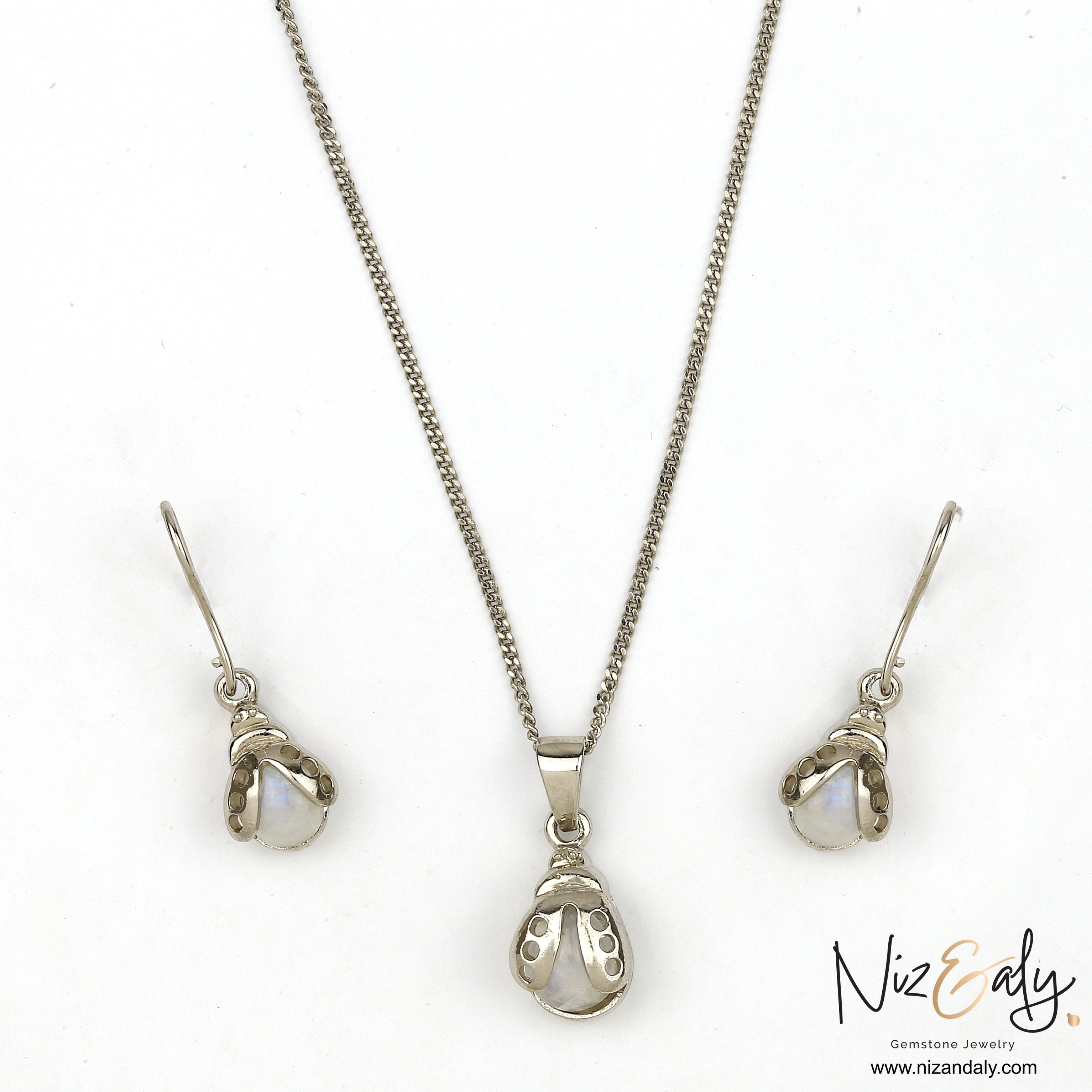 Niz & Aly moonstone bumble bee pendant and earring set in silver with iridescent gemstone accents.