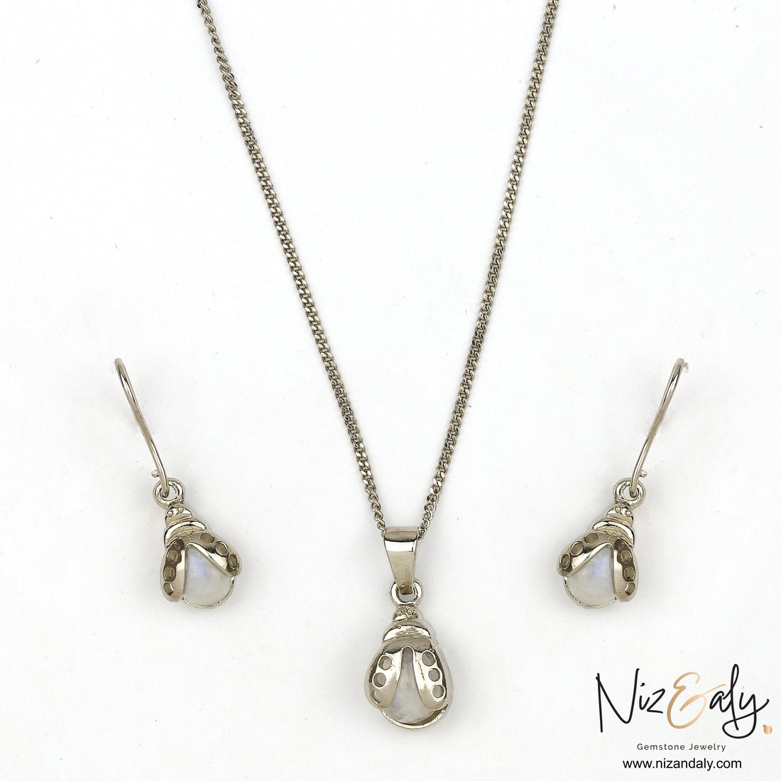 Niz & Aly moonstone bumble bee pendant and earring set in silver with iridescent gemstone accents.