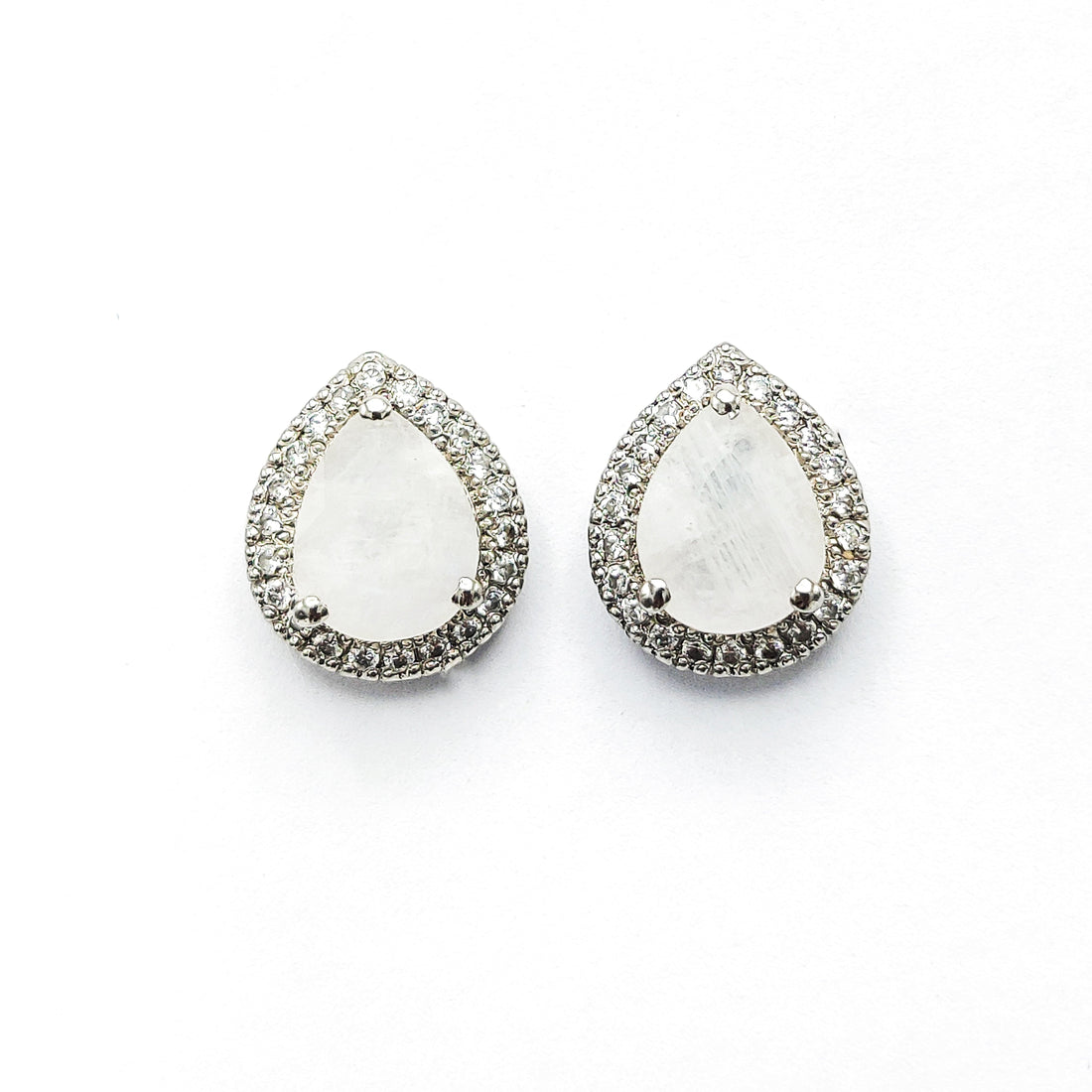 Niz & Aly pear-shaped moonstone stud earrings with a halo of sparkling crystals in a silver setting