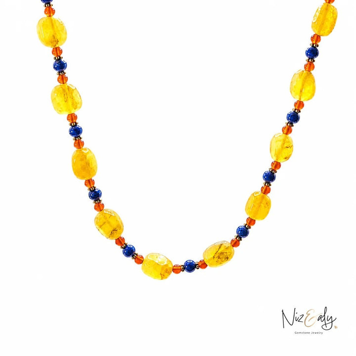 Niz & Aly multicolor beaded necklace featuring yellow agate, orange carnelian, and blue lapis lazuli gemstones.