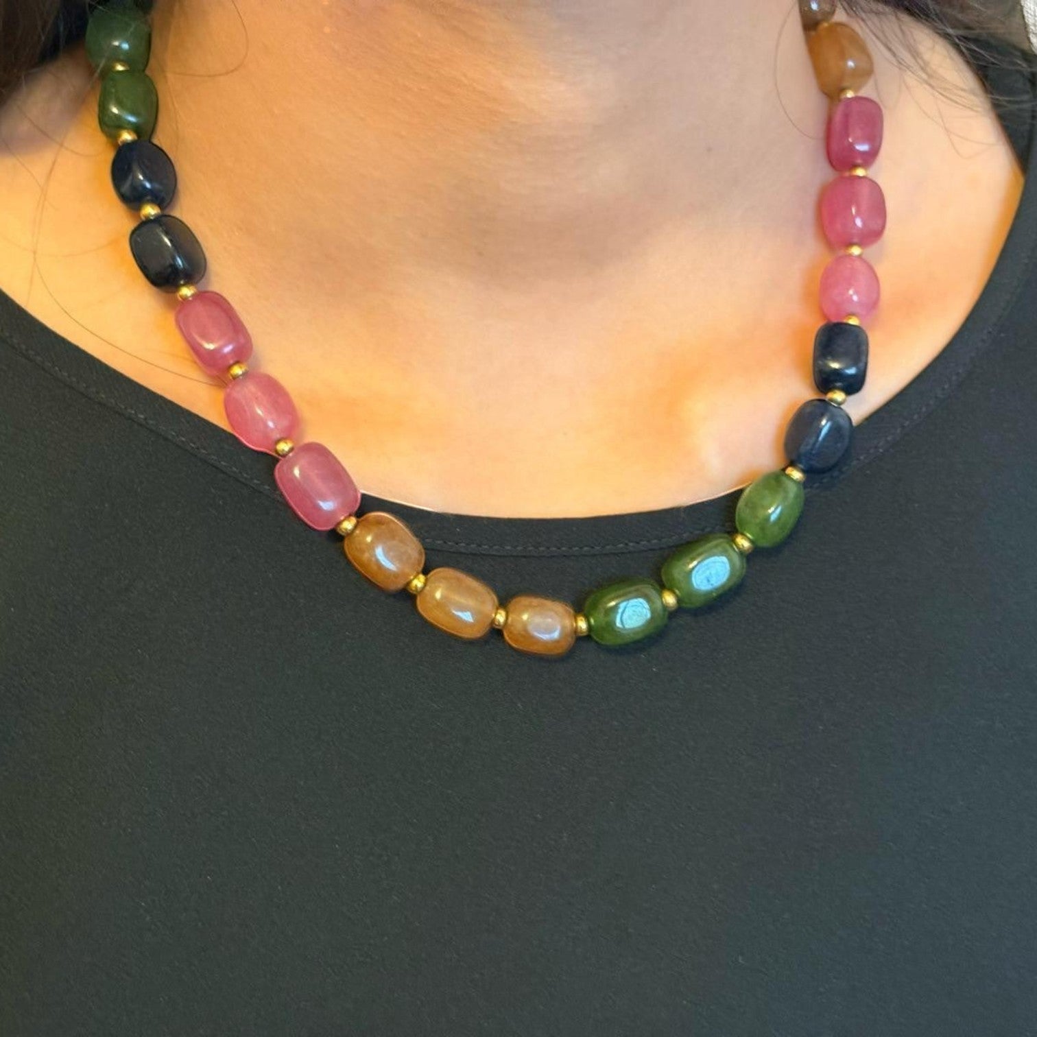 Niz & Aly multicolored rectangular jade-quartz gemstone necklace worn on a model with a black top.