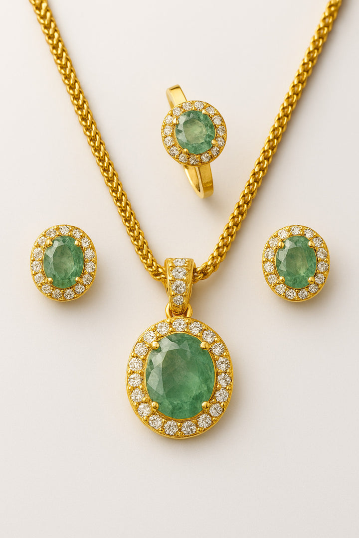 Niz & Aly Emeraude Halo natural emerald jewelry set with gold-plated sterling silver, oval emeralds, and clear stone halos.