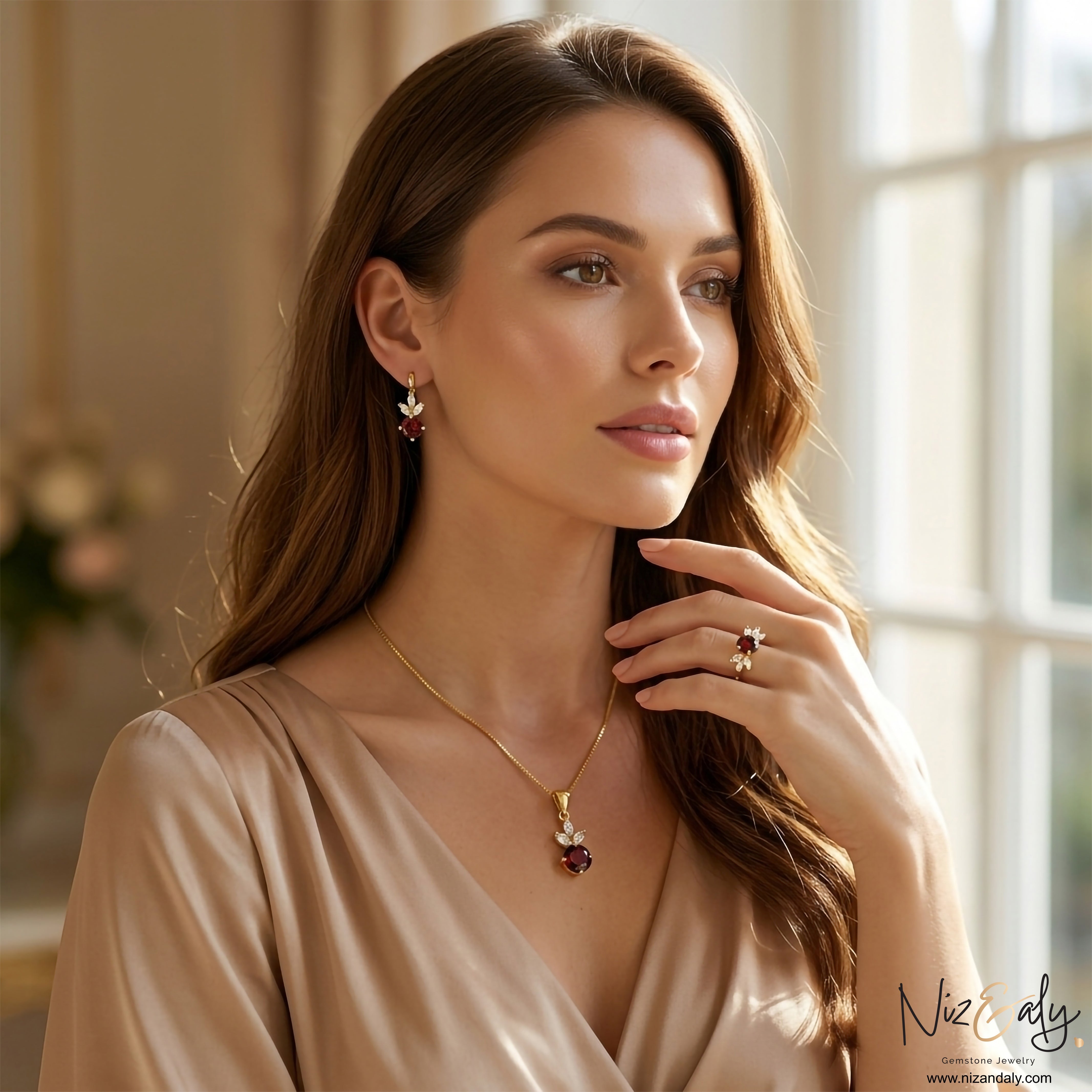 Niz & Aly natural garnet jewelry set featuring a pendant necklace, drop earrings, and ring with gold accents.