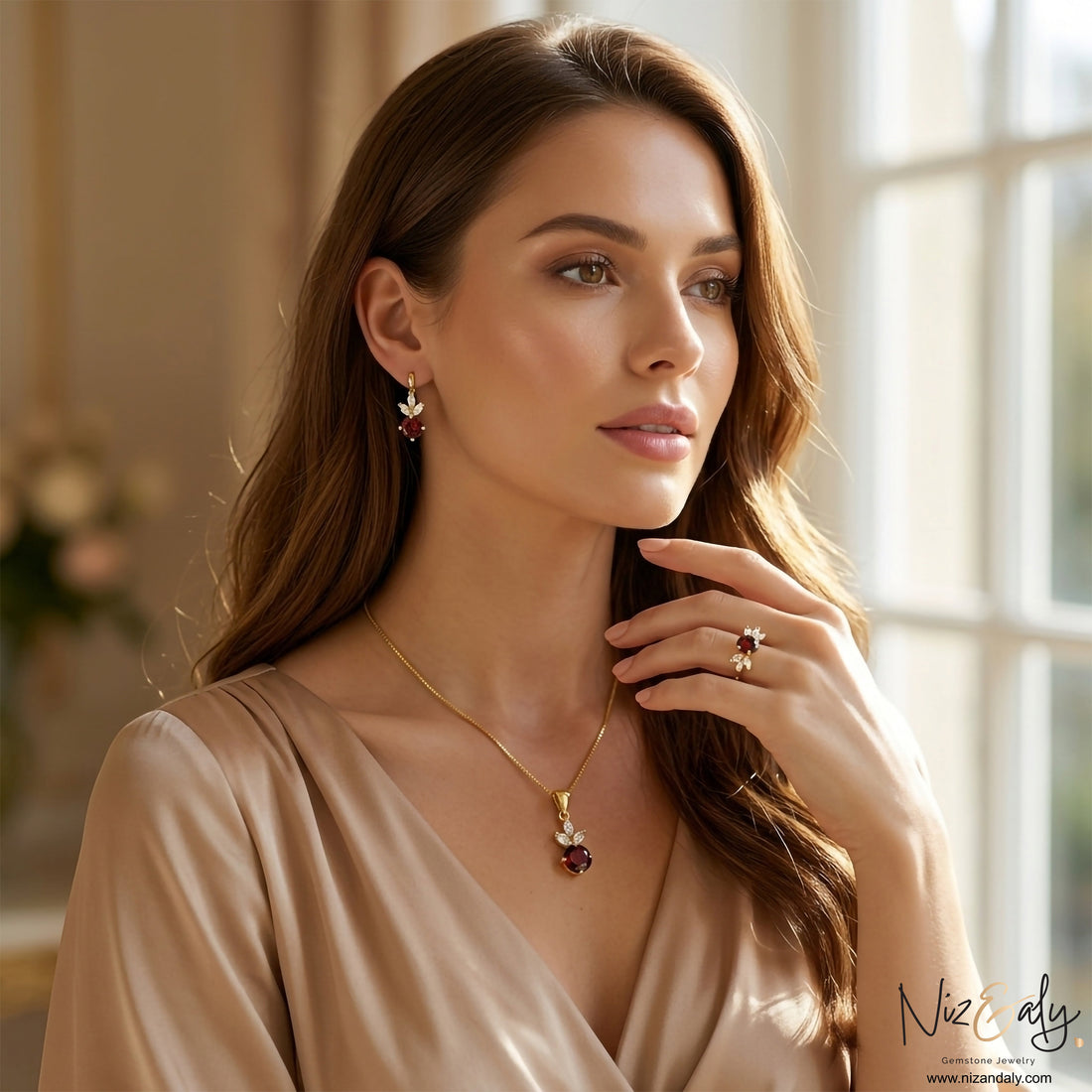 Niz & Aly natural garnet jewelry set featuring a pendant necklace, drop earrings, and ring with gold accents.