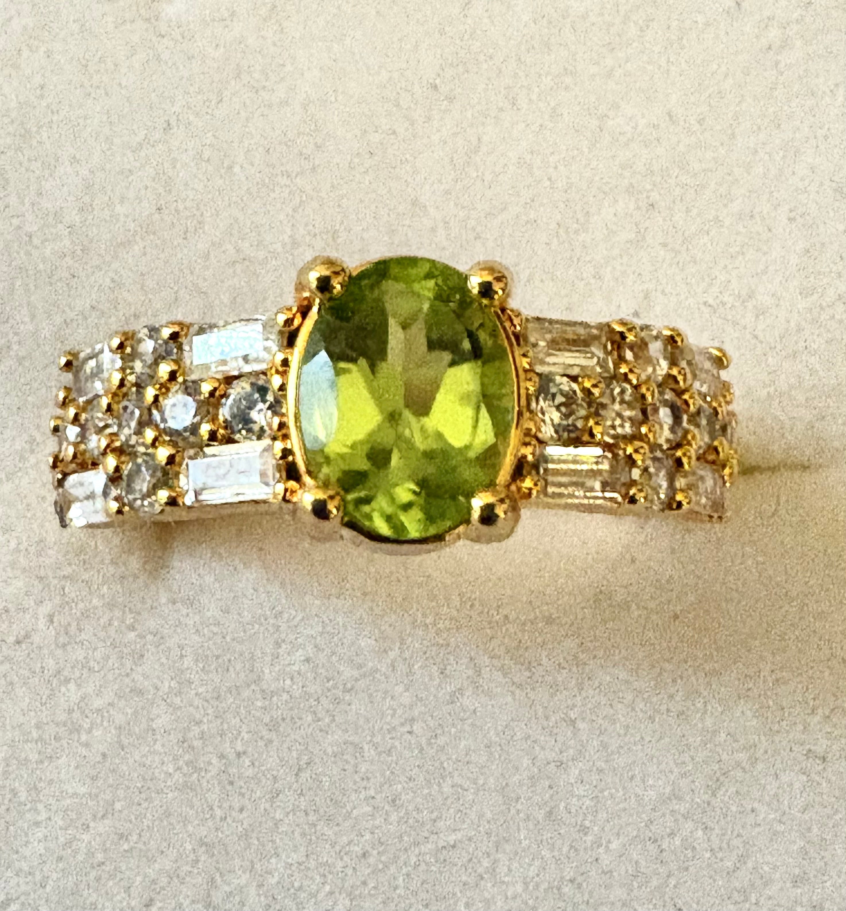 Niz & Aly natural apple green peridot ring with gold plating and sparkling AAA cubic zirconia baguette accents