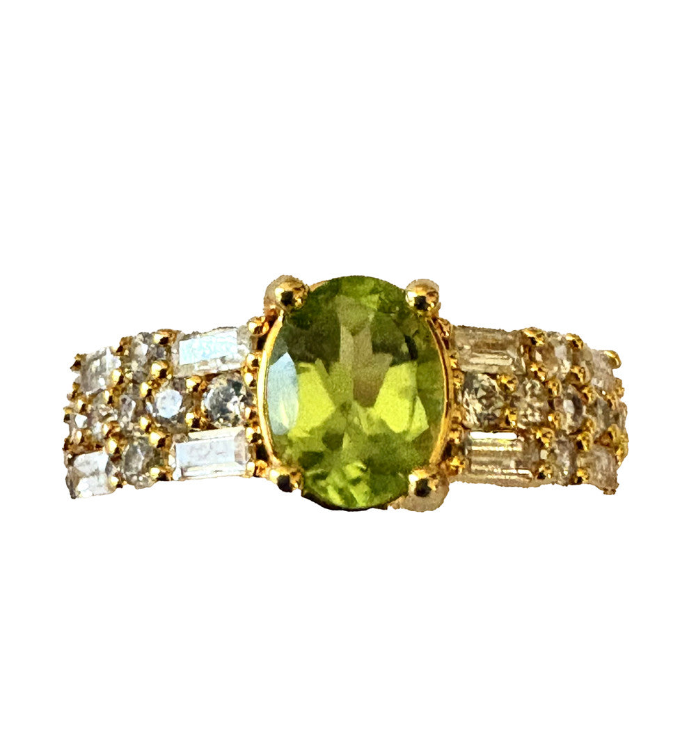 Niz & Aly natural peridot ring with gold plating and sparkling AAA cubic zirconia accents in an adjustable design.