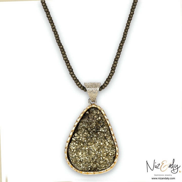 Niz & Aly natural pyrite pendant necklace with faceted pyrite beads and a sterling silver setting for elegant style.