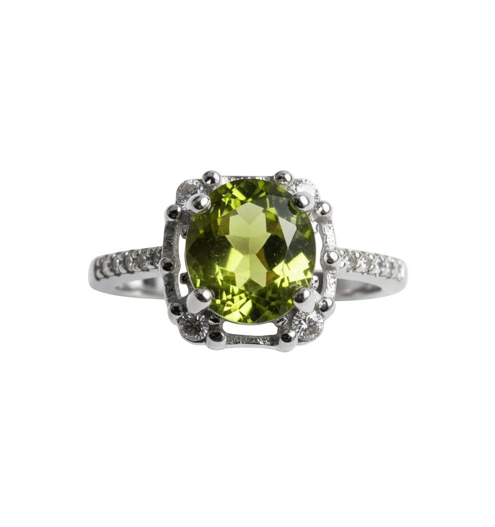 Niz & Aly Olive Bloom adjustable ring featuring an oval olive-green peridot gemstone set in a silver band.