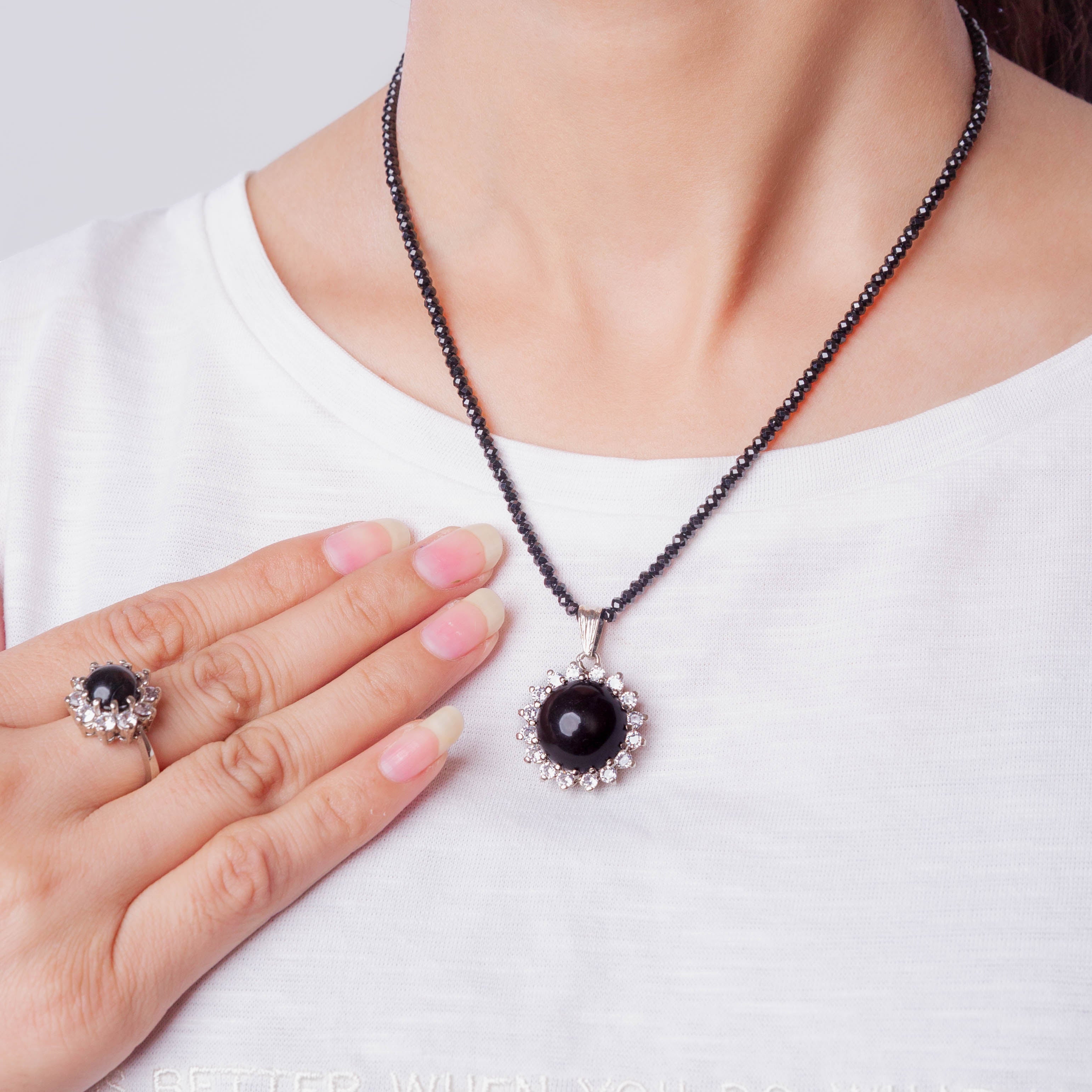 Niz & Aly Onyx Noir locket necklace and matching ring with polished black stones and crystal halo accents