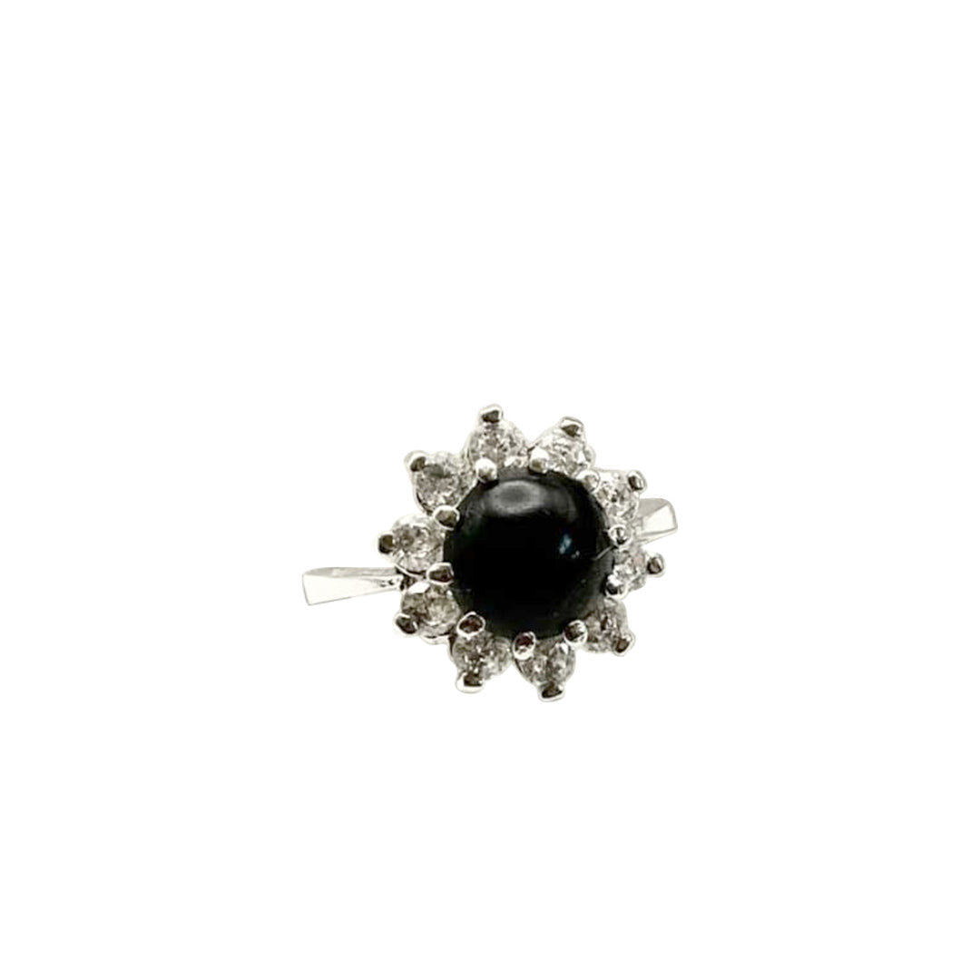 Niz & Aly Onyx Noir ring featuring a polished black onyx stone surrounded by a halo of sparkling white crystals.