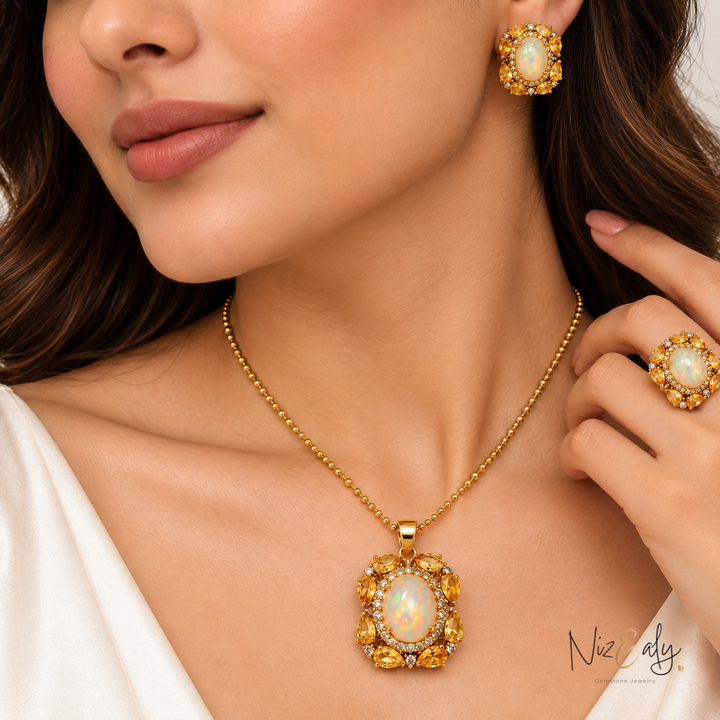 Niz & Aly jewelry set featuring an oval opal surrounded by yellow citrine and diamonds on a gold chain and ring