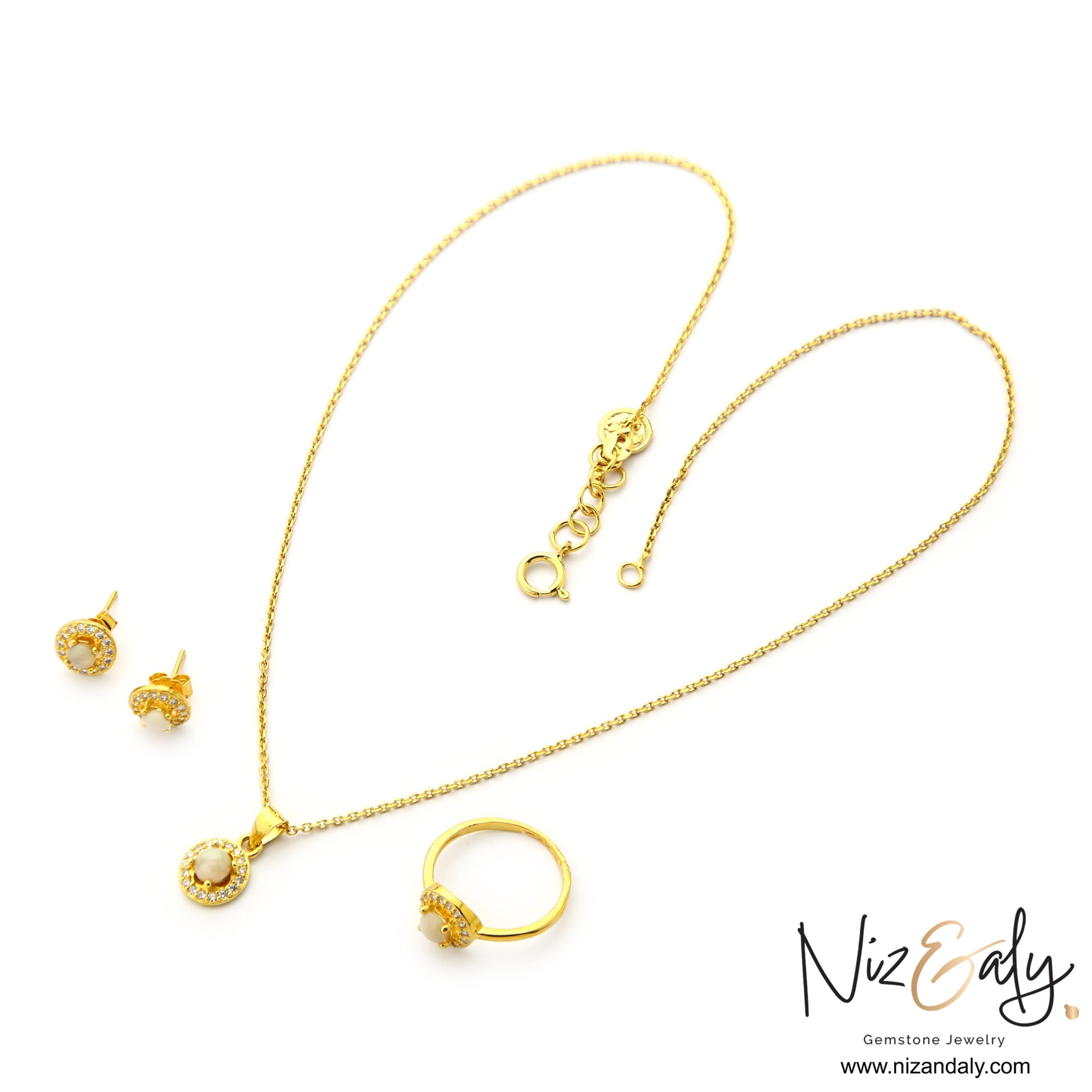 Niz & Aly dainty jewelry set featuring round Australian opal pendant necklace, stud earrings, and ring with halo stones.