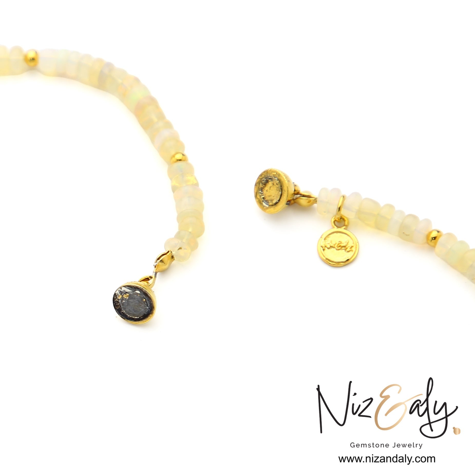 Niz & Aly Lunar Grace necklace featuring Ethiopian opal beads, freshwater pearls, and gold spacers with a branded charm.