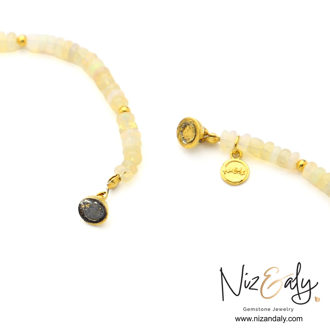 Niz & Aly Lunar Grace necklace featuring Ethiopian opal beads, freshwater pearls, and gold spacers with a branded charm.