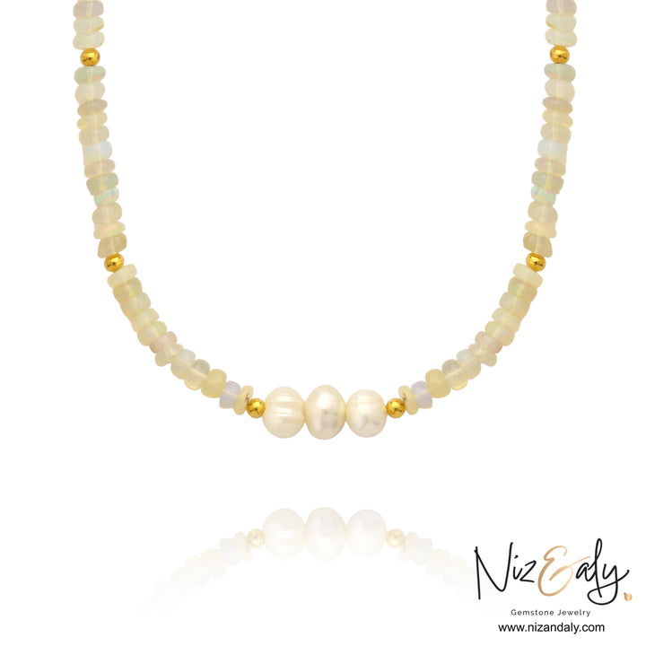 Niz & Aly Lunar Grace necklace featuring Ethiopian opal beads, three freshwater pearls, and gold spacers.