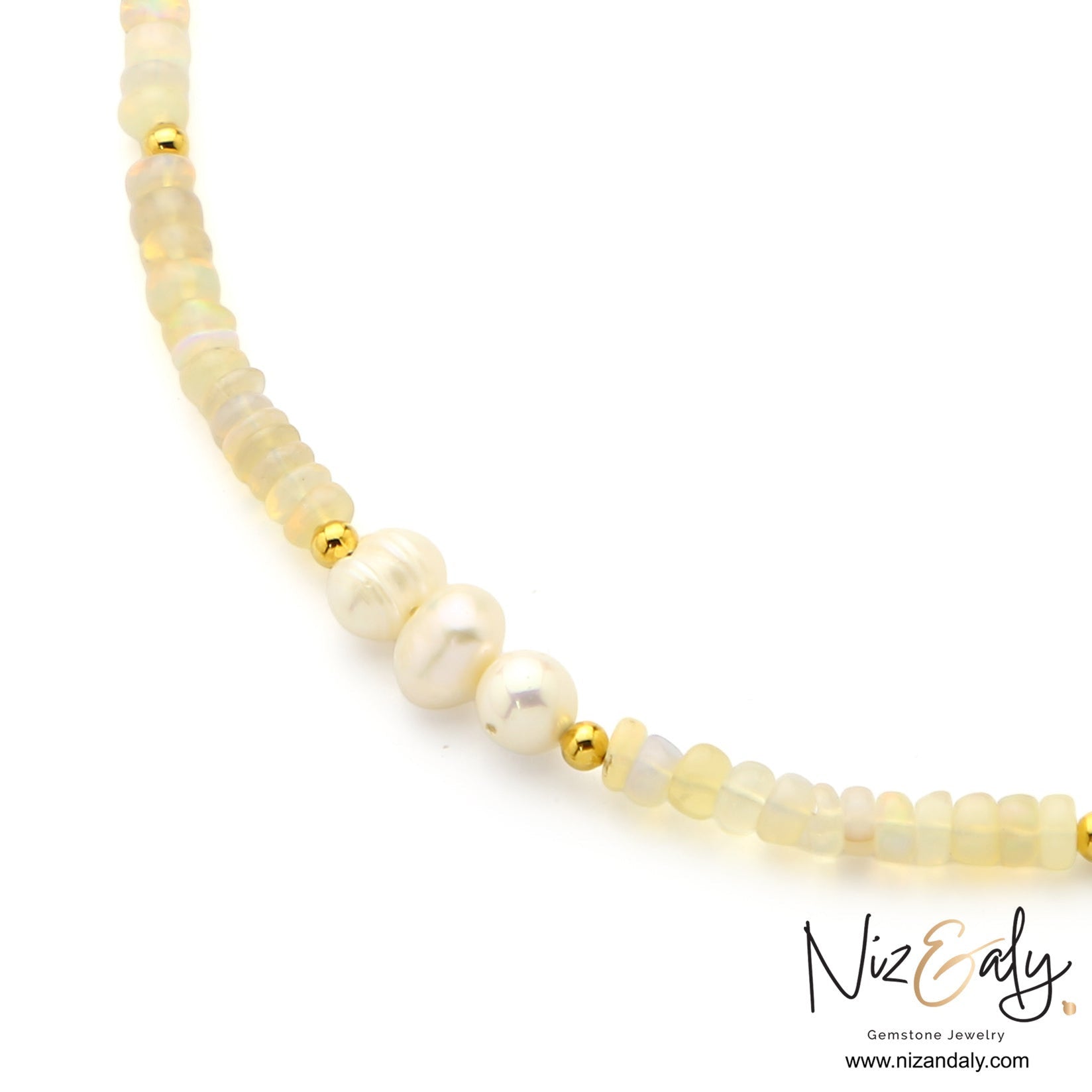Niz & Aly Lunar Grace necklace featuring Ethiopian opal beads, three freshwater pearls, and gold spacers.