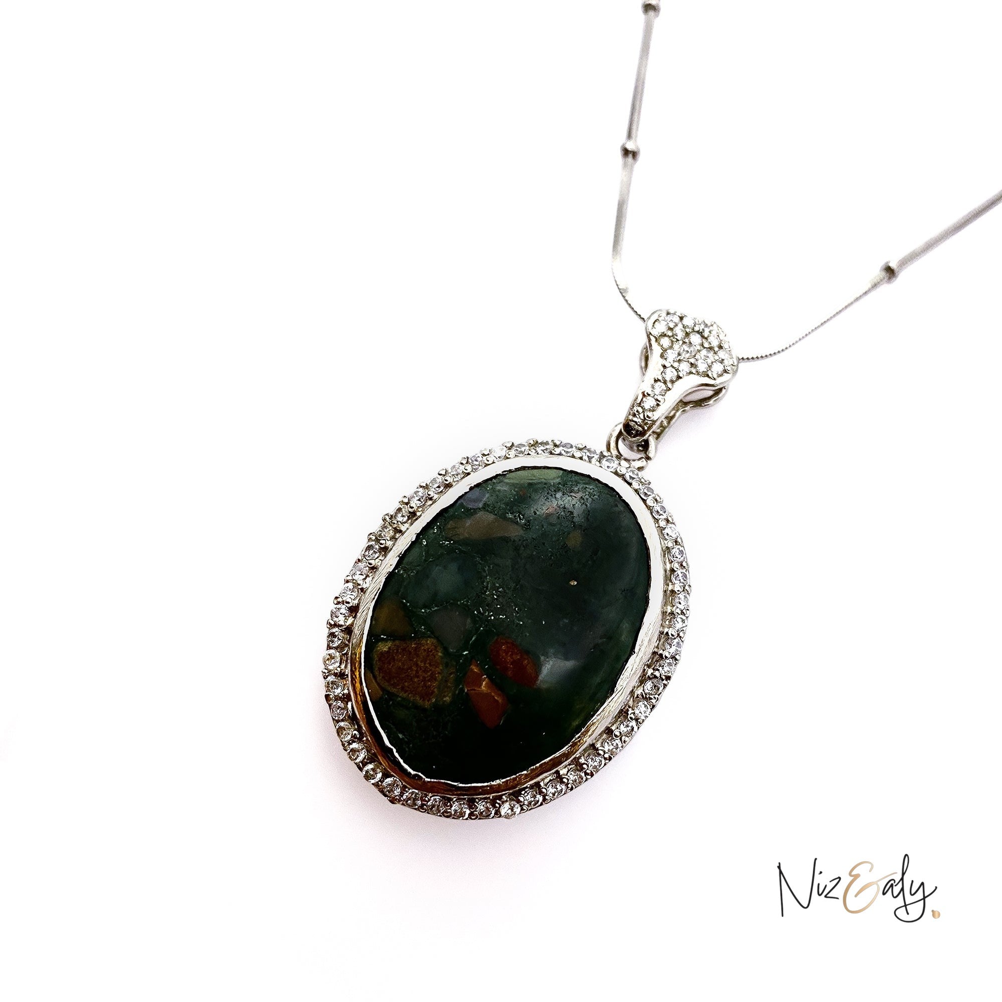 Niz & Aly oval natural bloodstone pendant with red flecks, framed by a sparkling crystal halo on a silver chain.