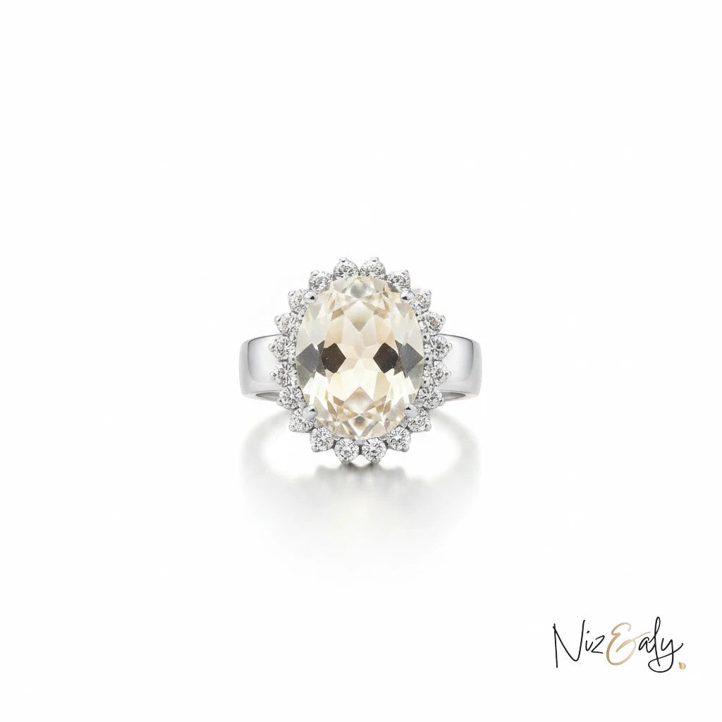 Niz & Aly designer ring featuring a large oval-cut citrine stone surrounded by a sparkling diamond halo in silver.