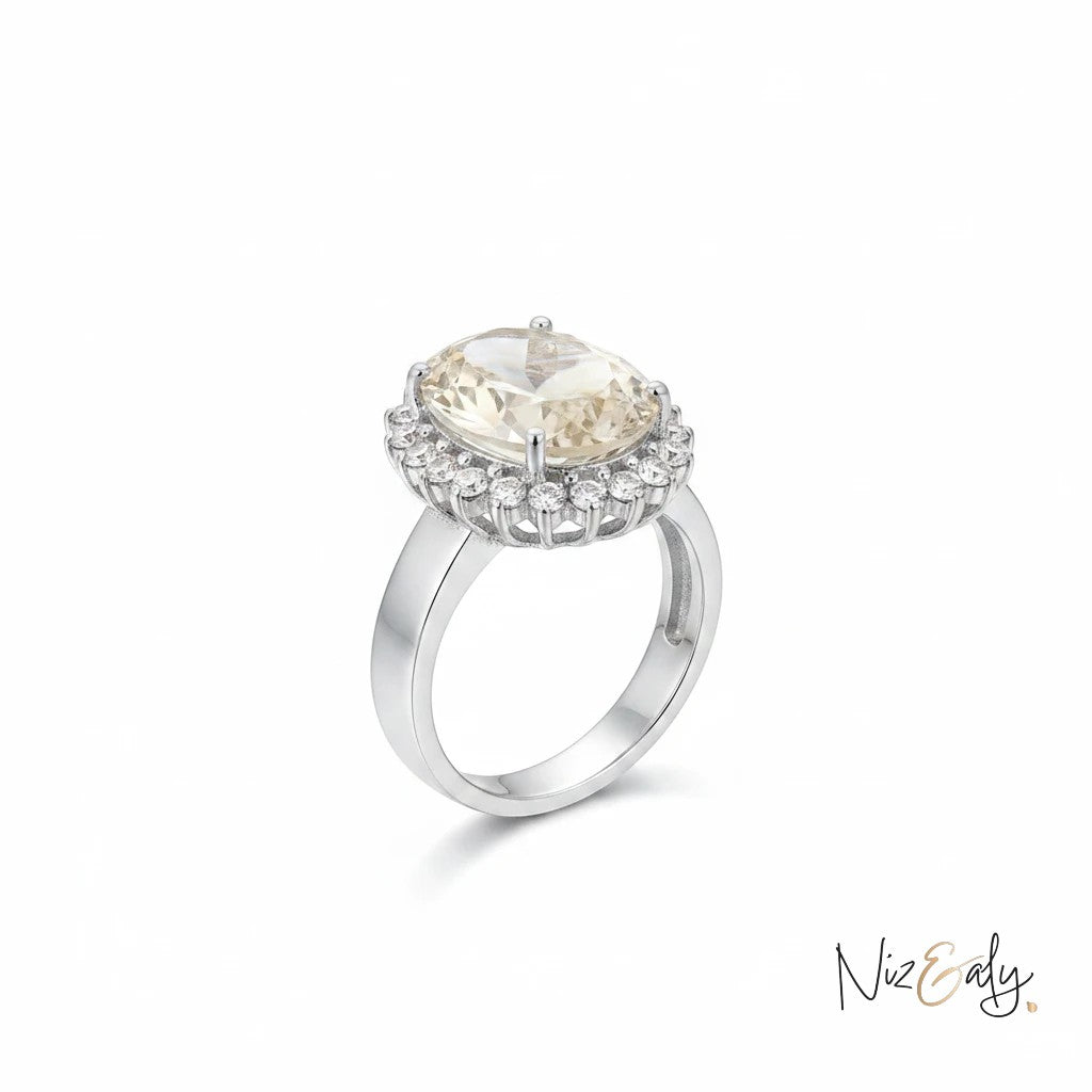 Niz & Aly oval citrine ring with a halo of sparkling diamonds set in polished silver for an elegant look.