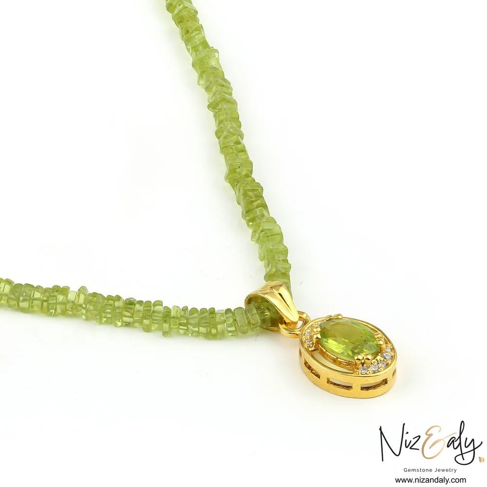 Niz & Aly oval Arizona peridot pendant on a green beaded necklace with gold-plated sterling silver setting
