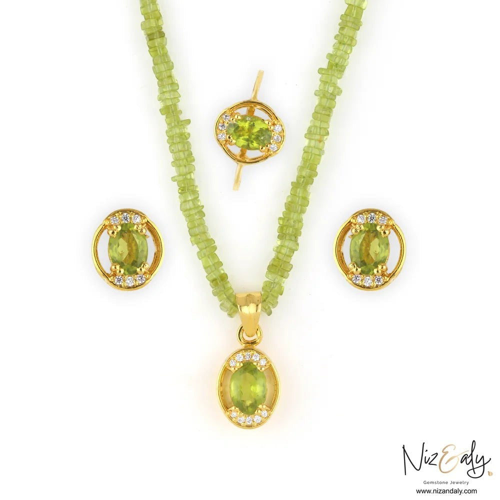 Niz & Aly oval Arizona peridot pendant set with beaded necklace, stud earrings, and ring in gold-plated silver.