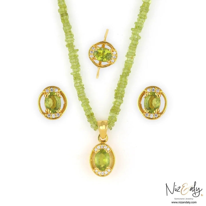 Niz & Aly oval Arizona peridot pendant set with beaded necklace, stud earrings, and ring in gold-plated silver.