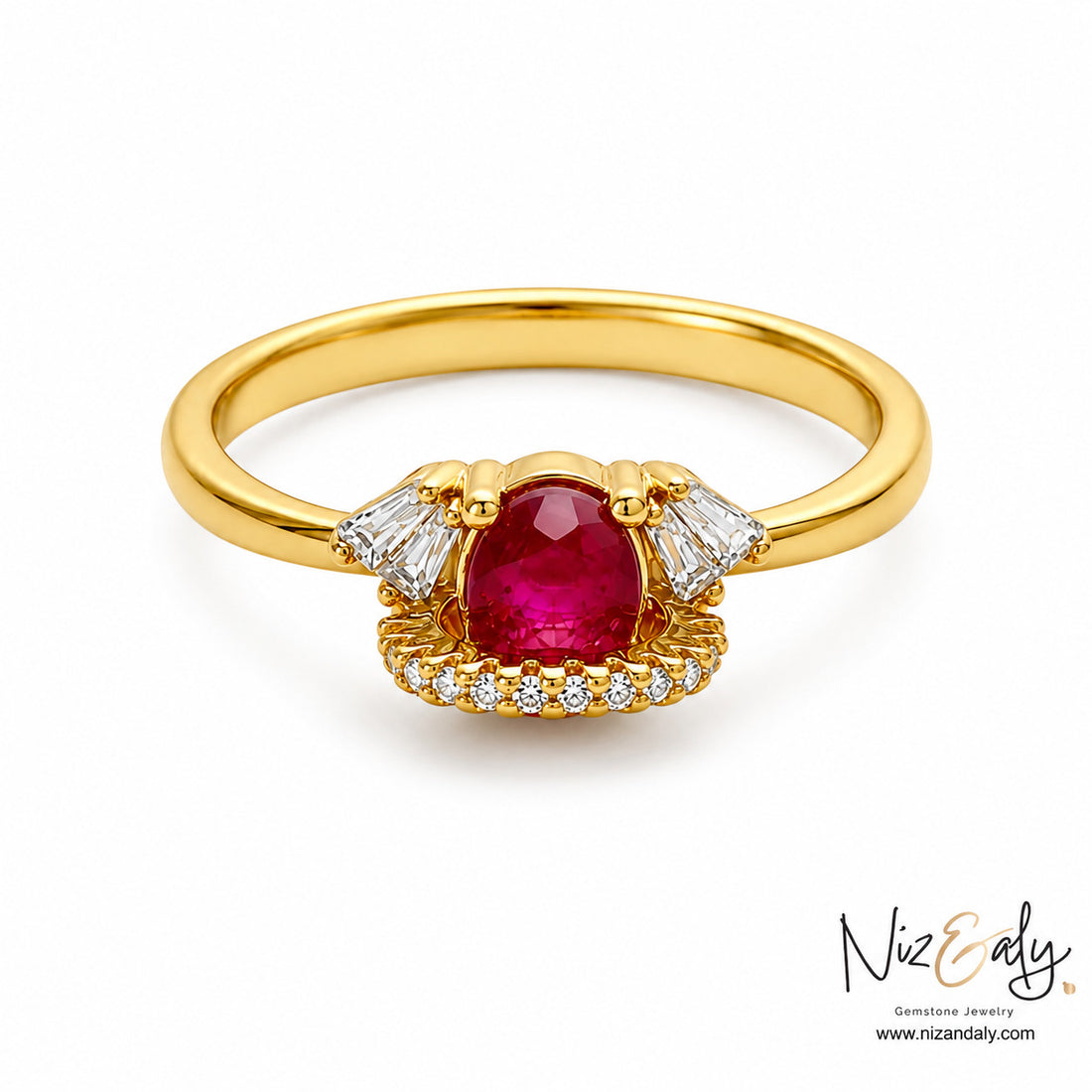 Niz & Aly oval ruby ring in 18k gold with baguette and pavé diamond accents on a white background.