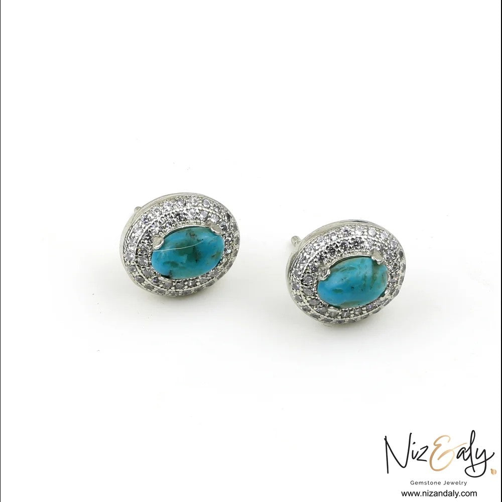 Niz & Aly oval turquoise stud earrings with a sparkling white cubic zirconia halo in a polished silver-toned setting