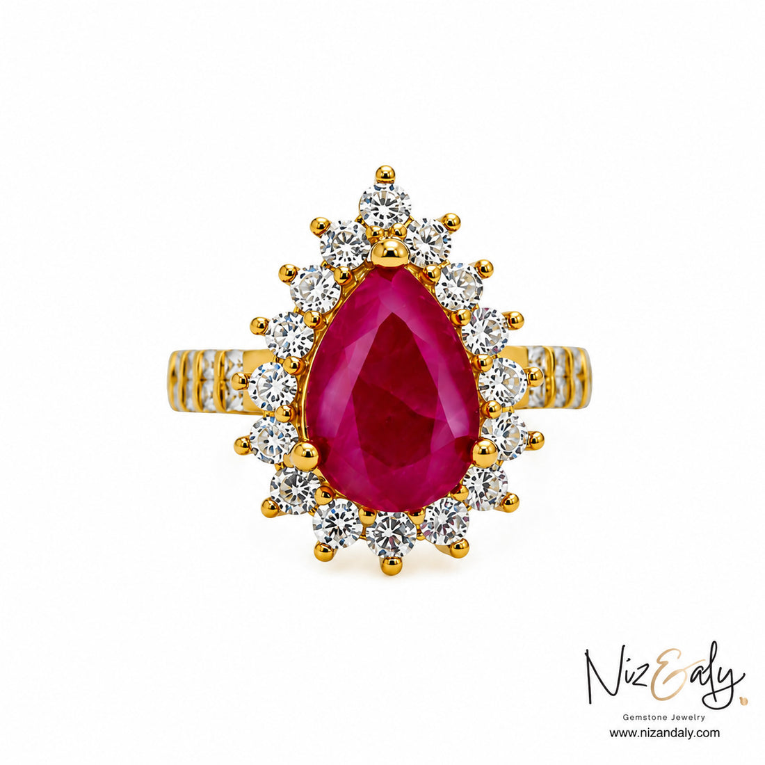 Niz & Aly pear-cut natural ruby ring with a diamond halo set in polished yellow gold
